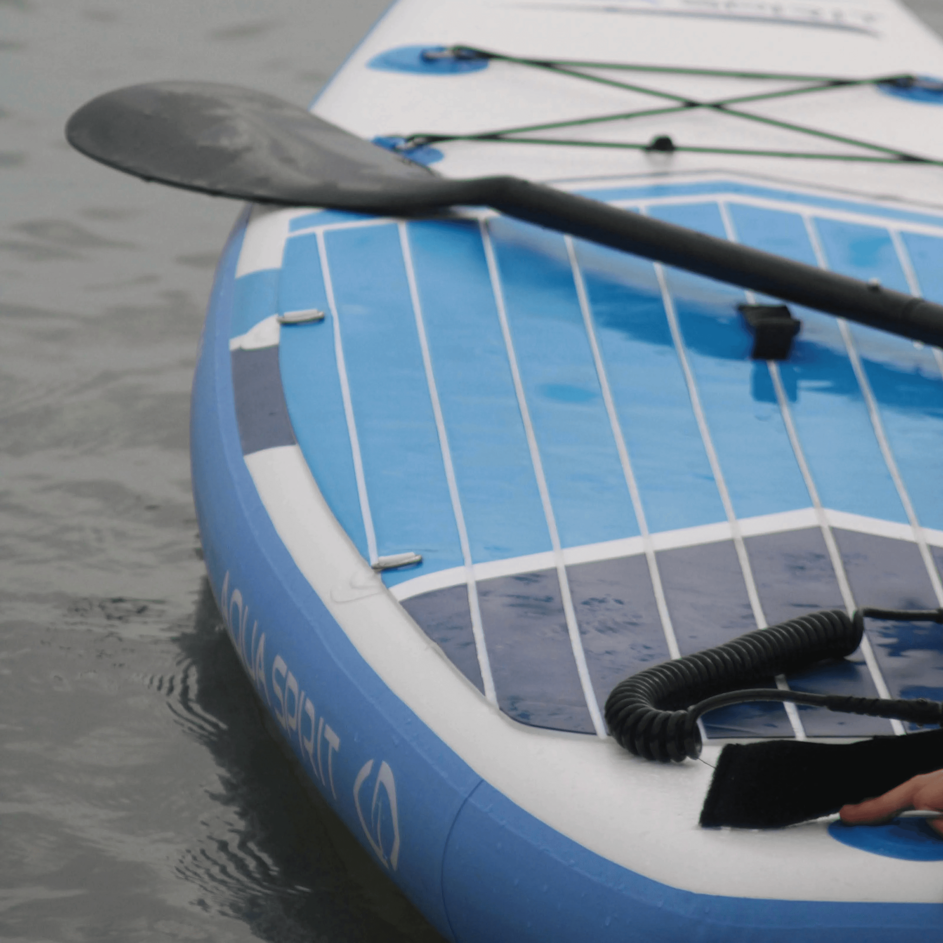 a white boat with a fin
