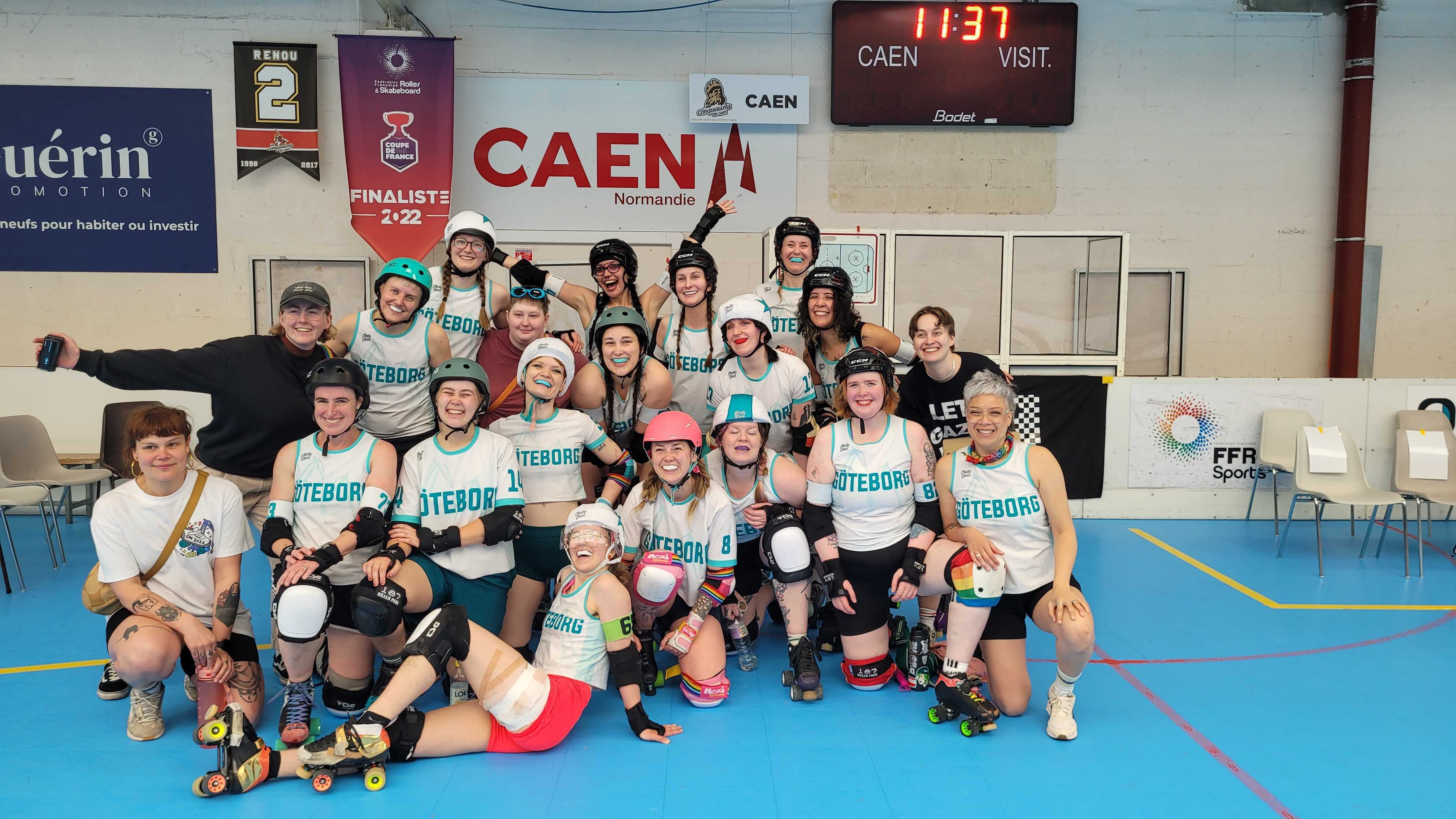 Three roller derby players tackling each other.