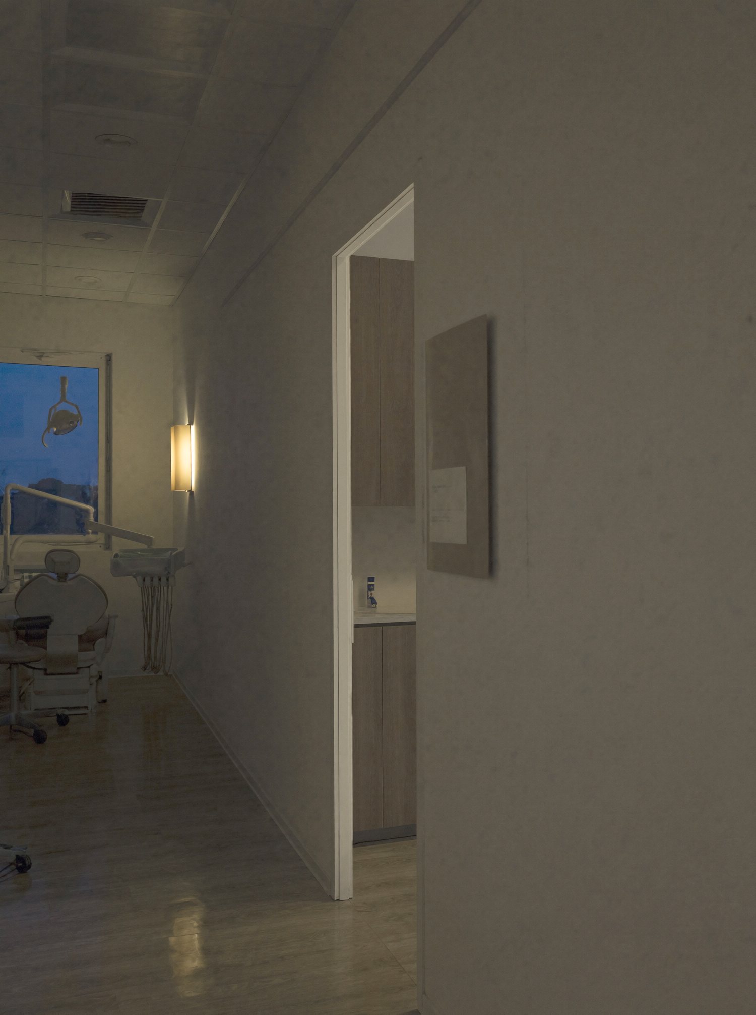 The practice corridor at night with one treatment room light on