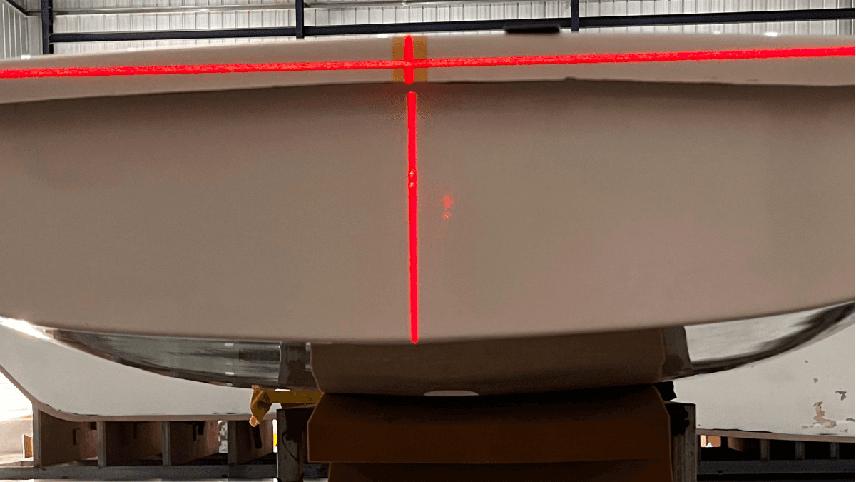 a person swimming in the water with grass