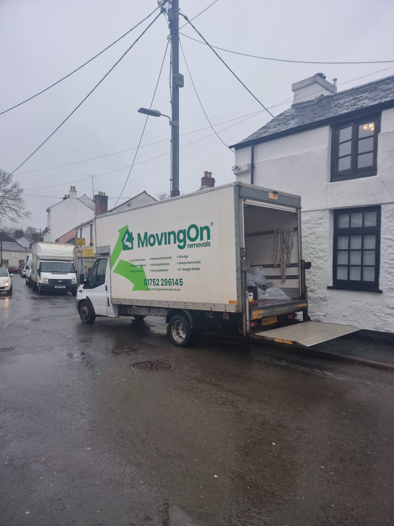 A Moving On Removals transit van operating a house removals service in Plympton, Plymouth.