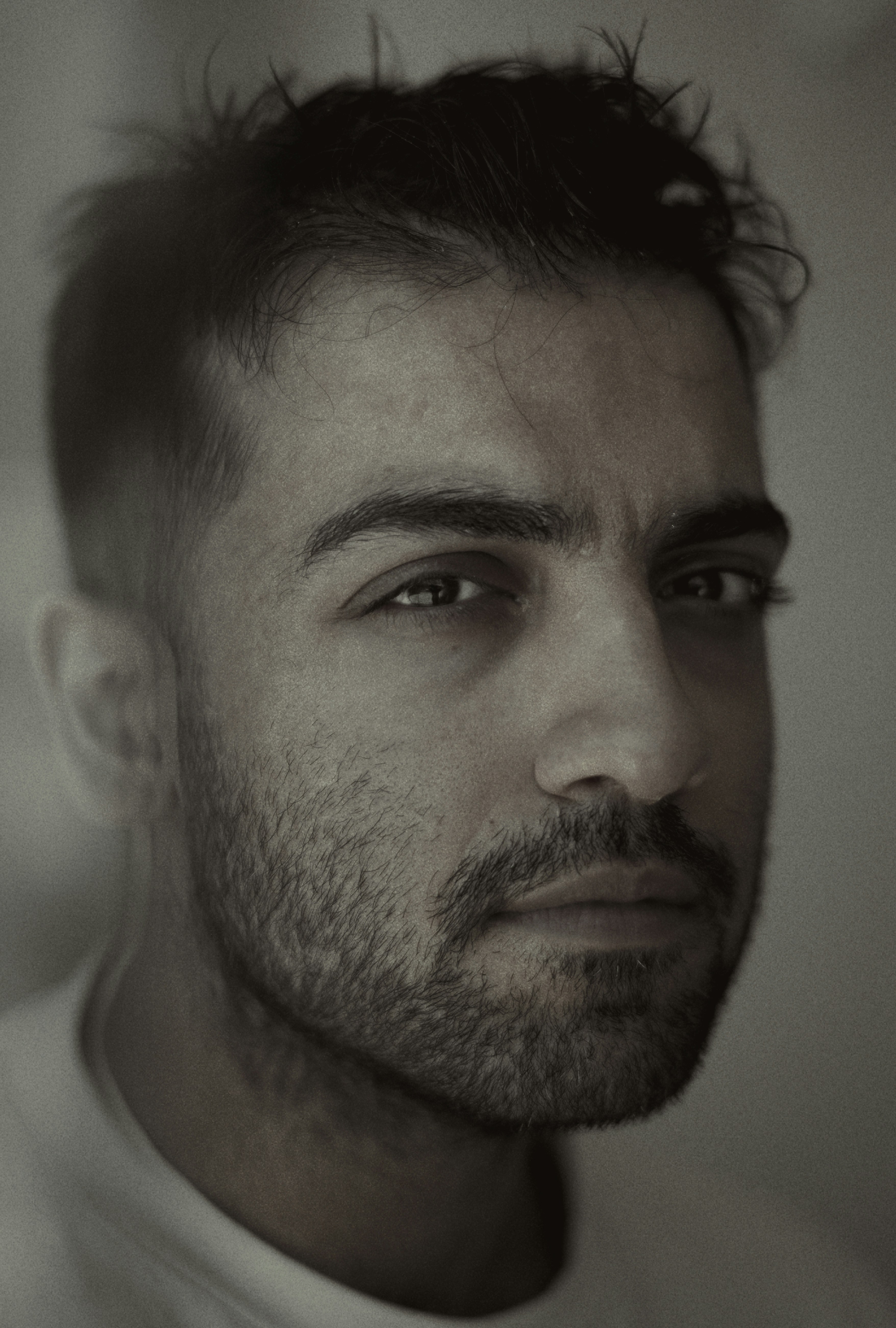 A man stares intensely at the camera.