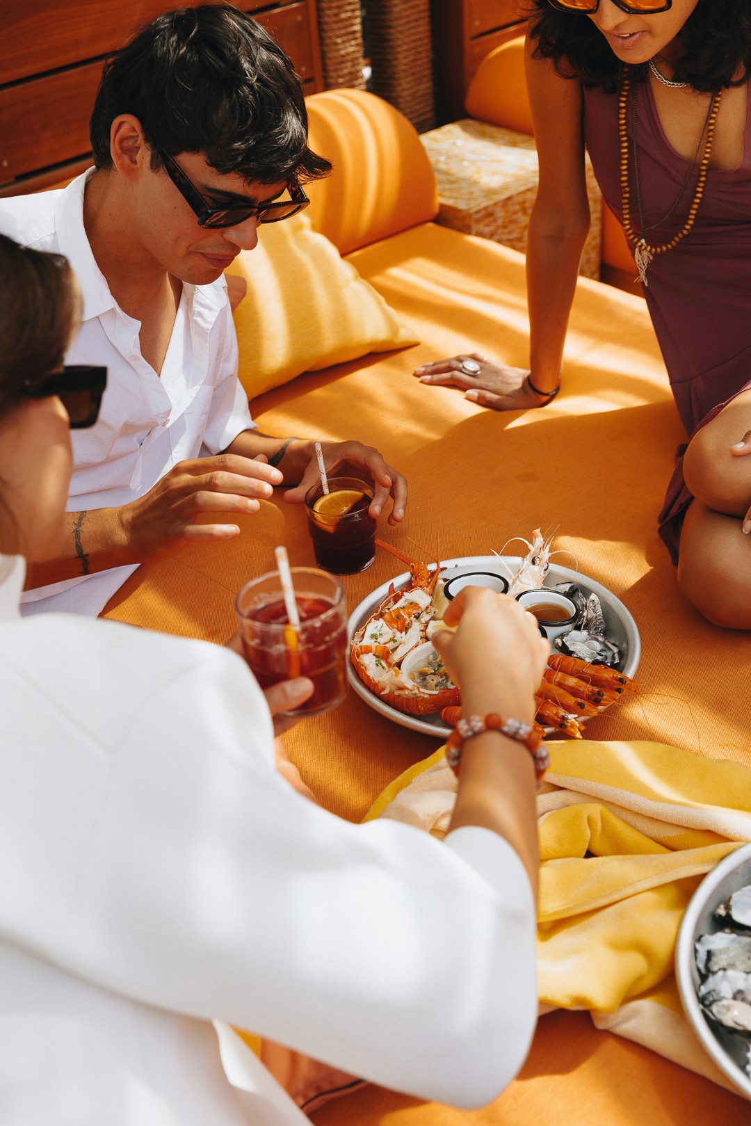 People enjoying a platter in Afloat's Beach Club Lounge