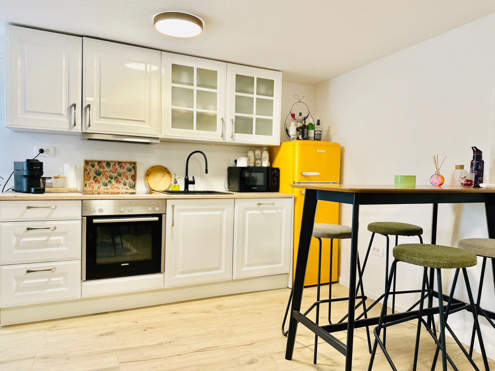 Bedroom with wall bookshelf and mountain view.