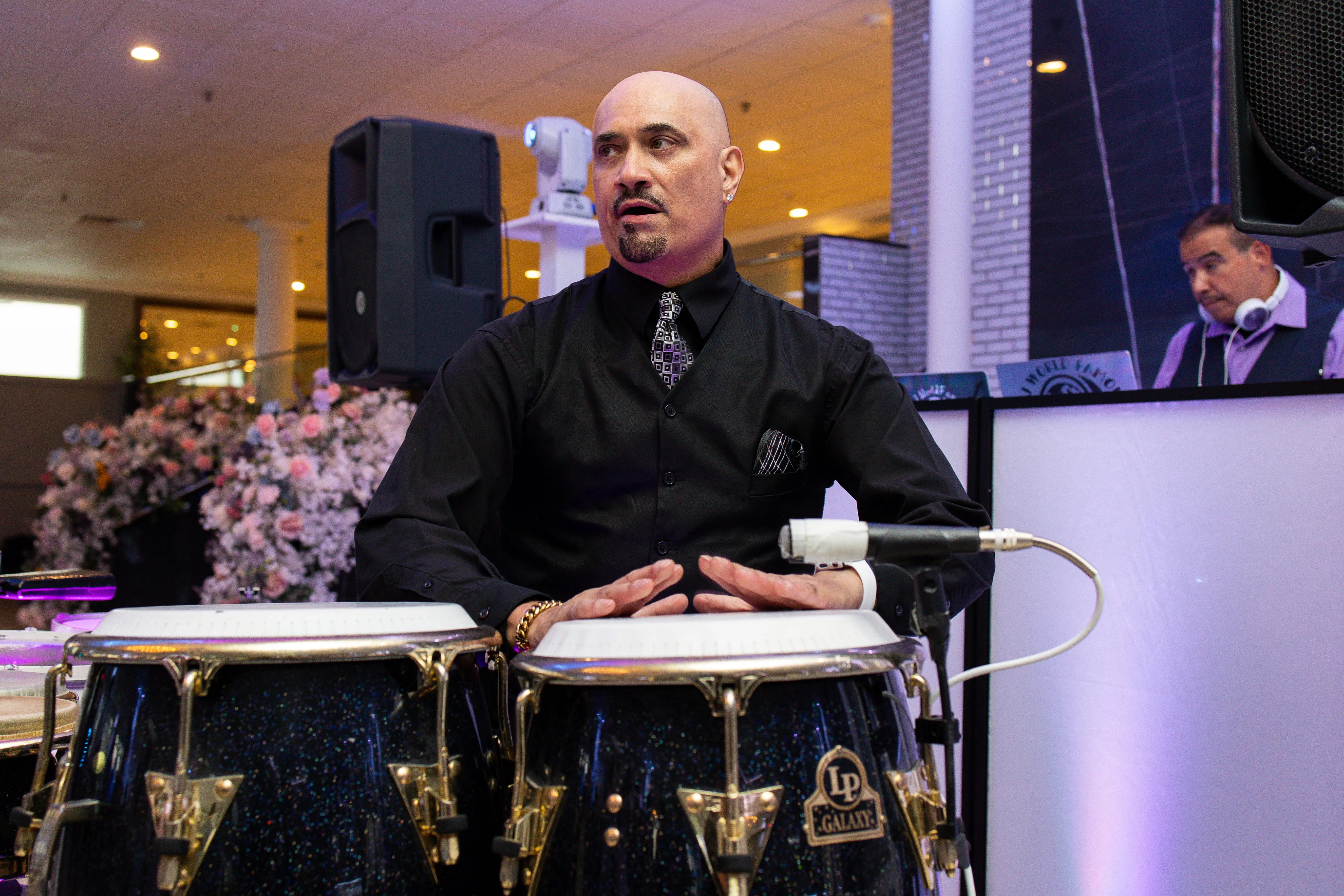 Wedding percussionist performing live alongside DJ at reception