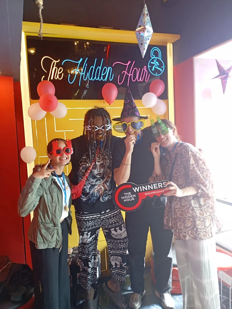 Participants of all ages enjoying puzzles and games at a team and birthday event