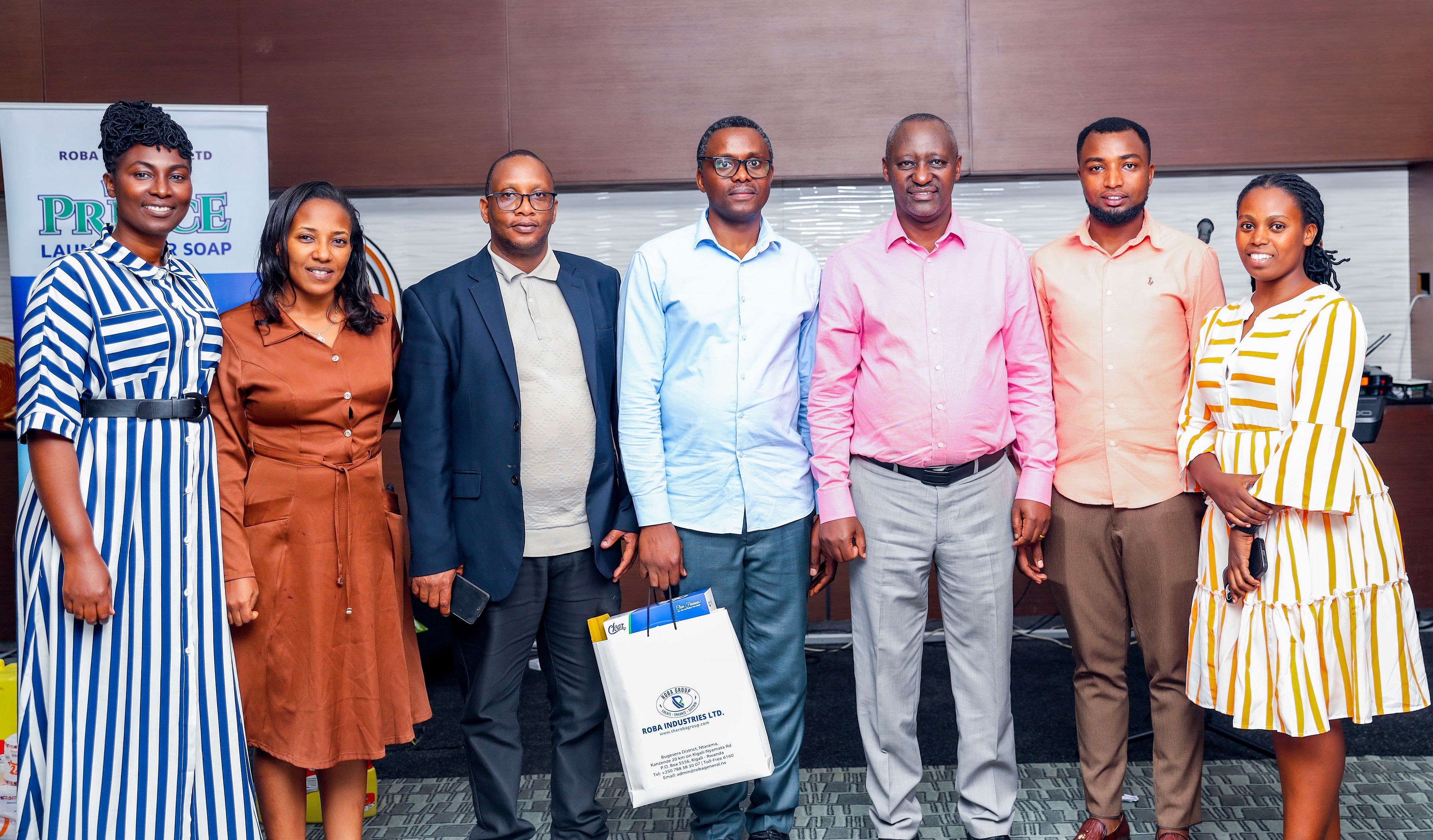 In chemical manufacturing lab,close up shot of a hand pouring liquid in a small glass bottle