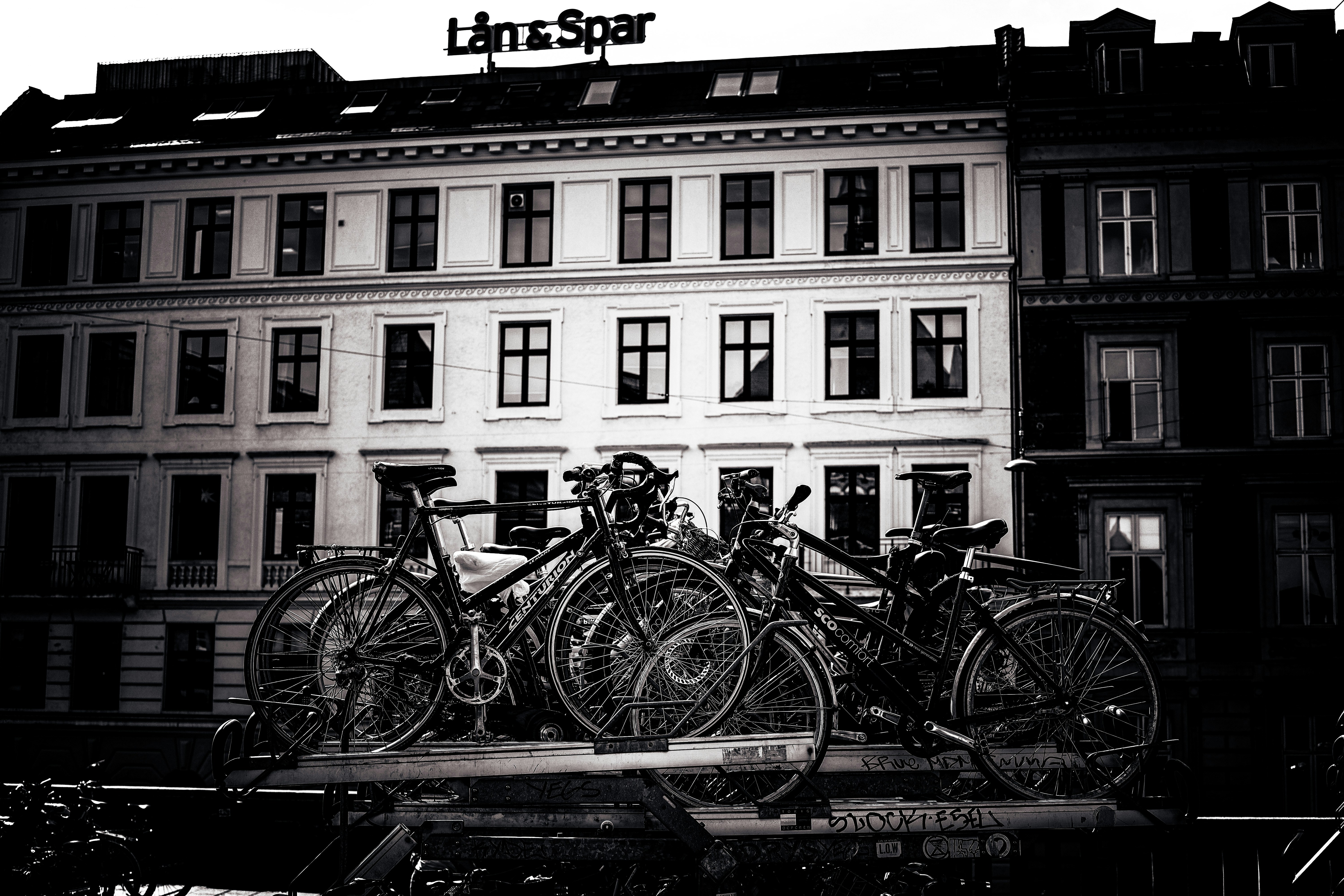 bicycles parked on a railing
