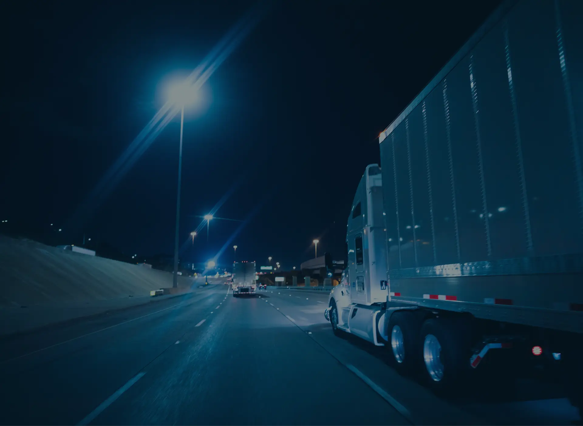 Trucks on the road at night