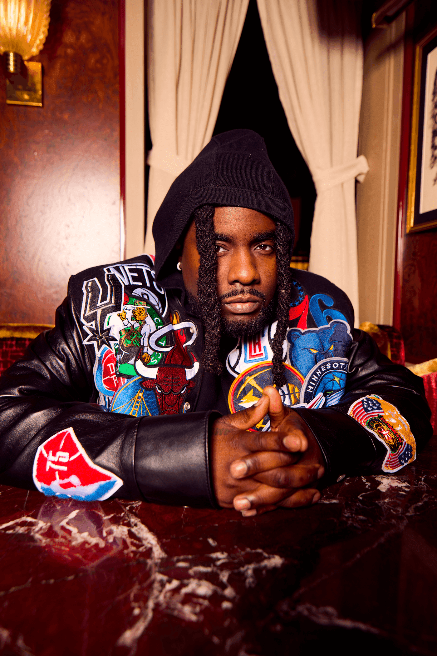 Snow-capped mountains viewed through a car window.