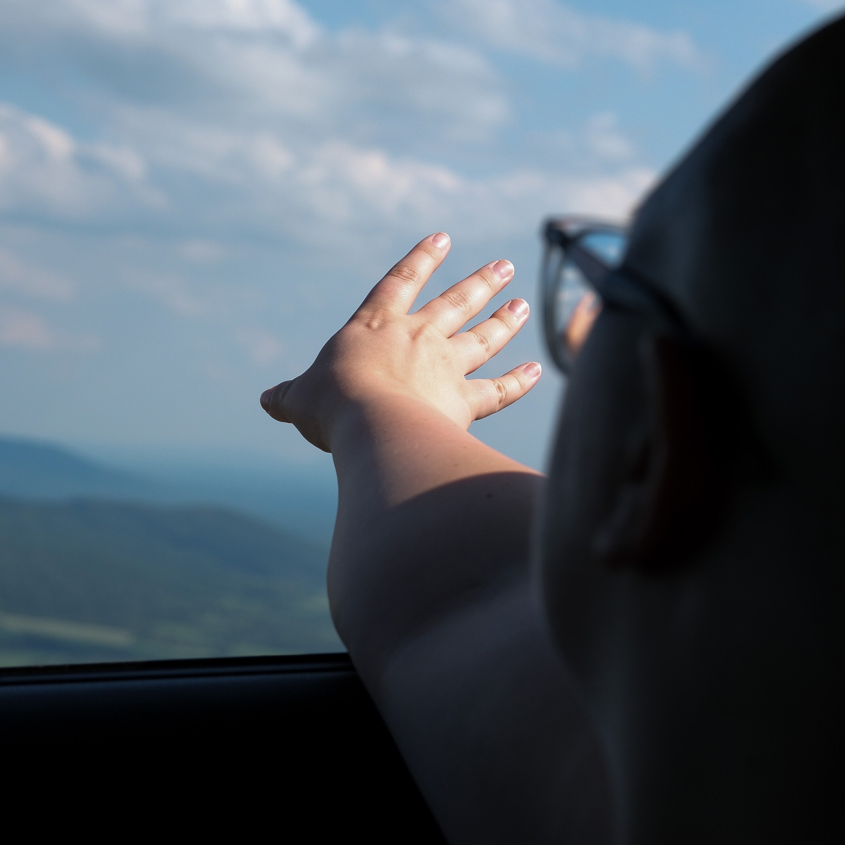 Streetside billboard with flyposters of the Batch.Works brand and illustrations
