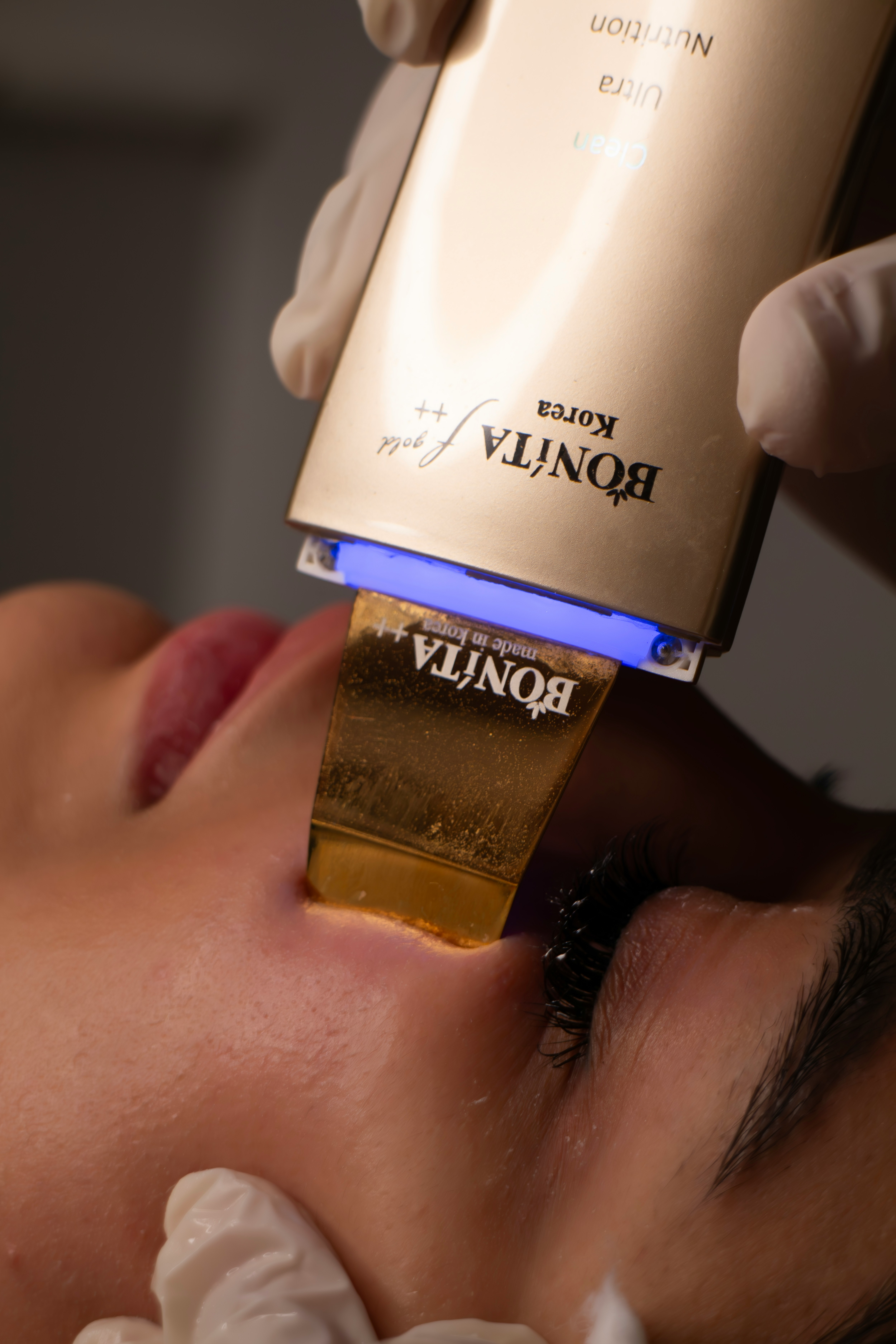 Skincare device cleanses woman's face