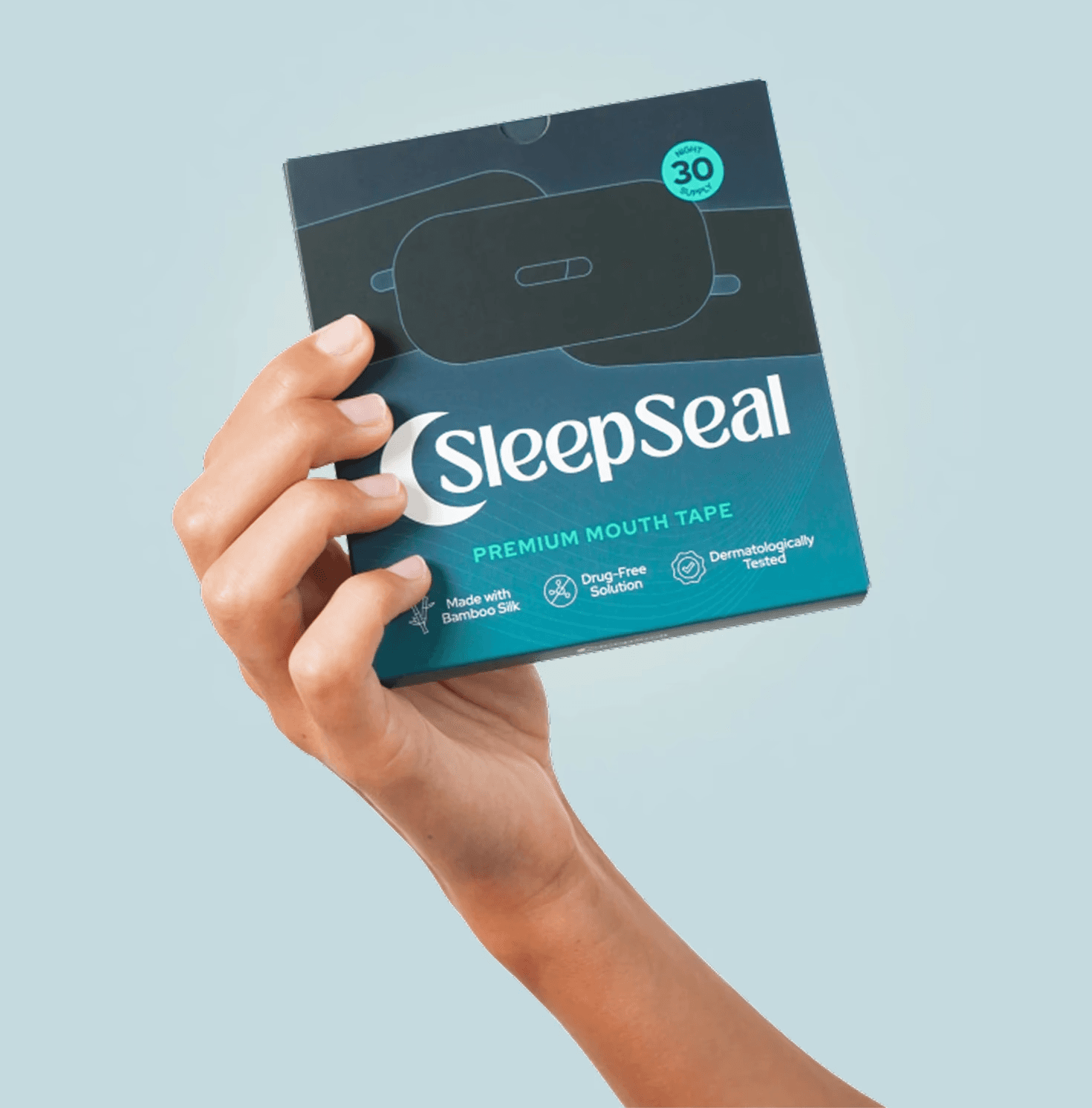 A hand holding SleepSeal premium mouth tape