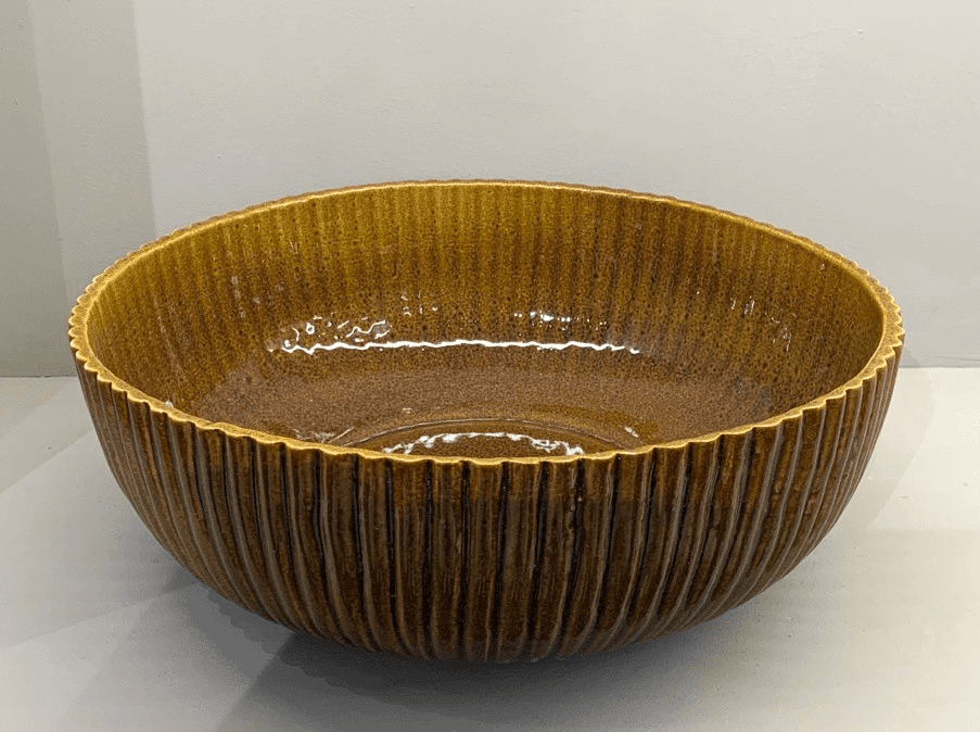 Amber glaze ribbed ceramic serving bowl