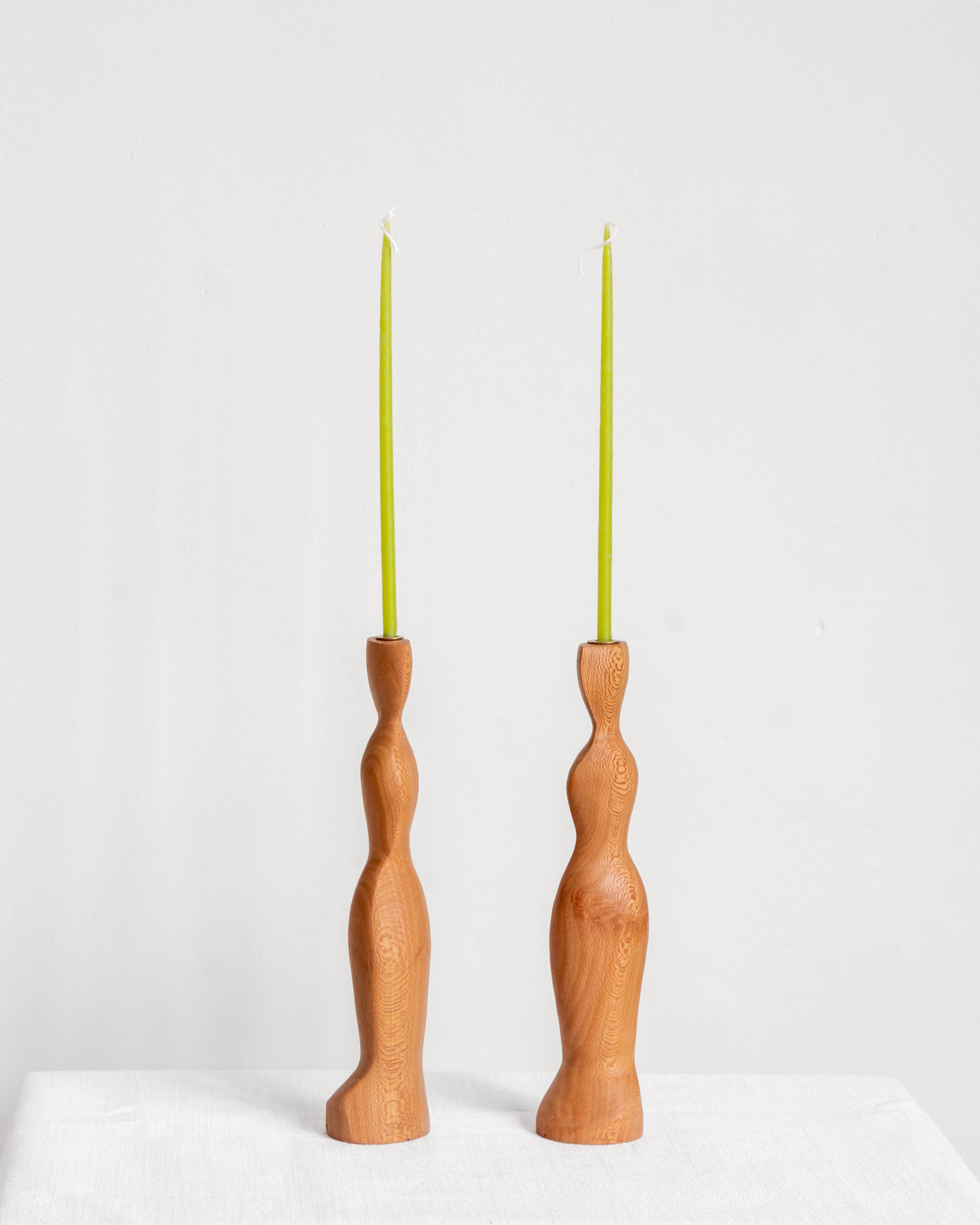 Figura Candlestick holders in London Plane on white background with green candles