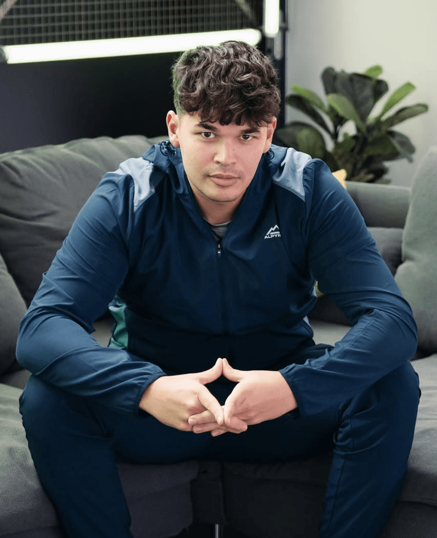 headshot of male in dark background