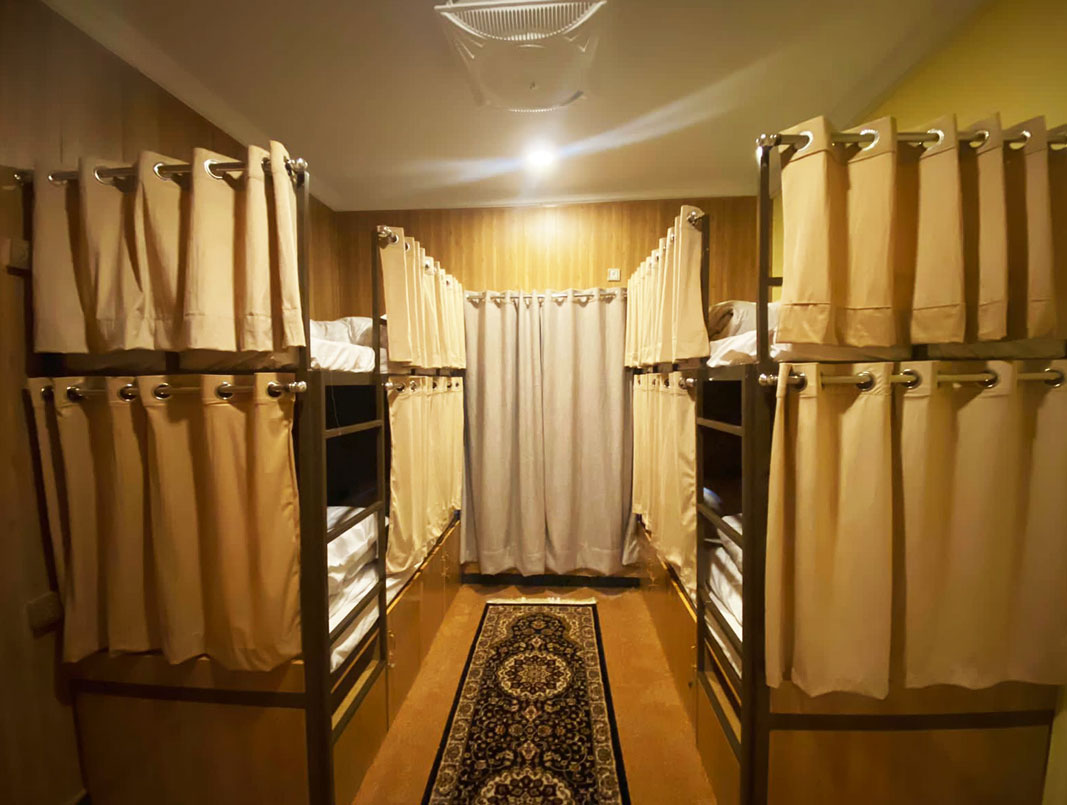 4 bunk beds in the lower Quetta dorm room at Coyote Den Hostel, Islamabad