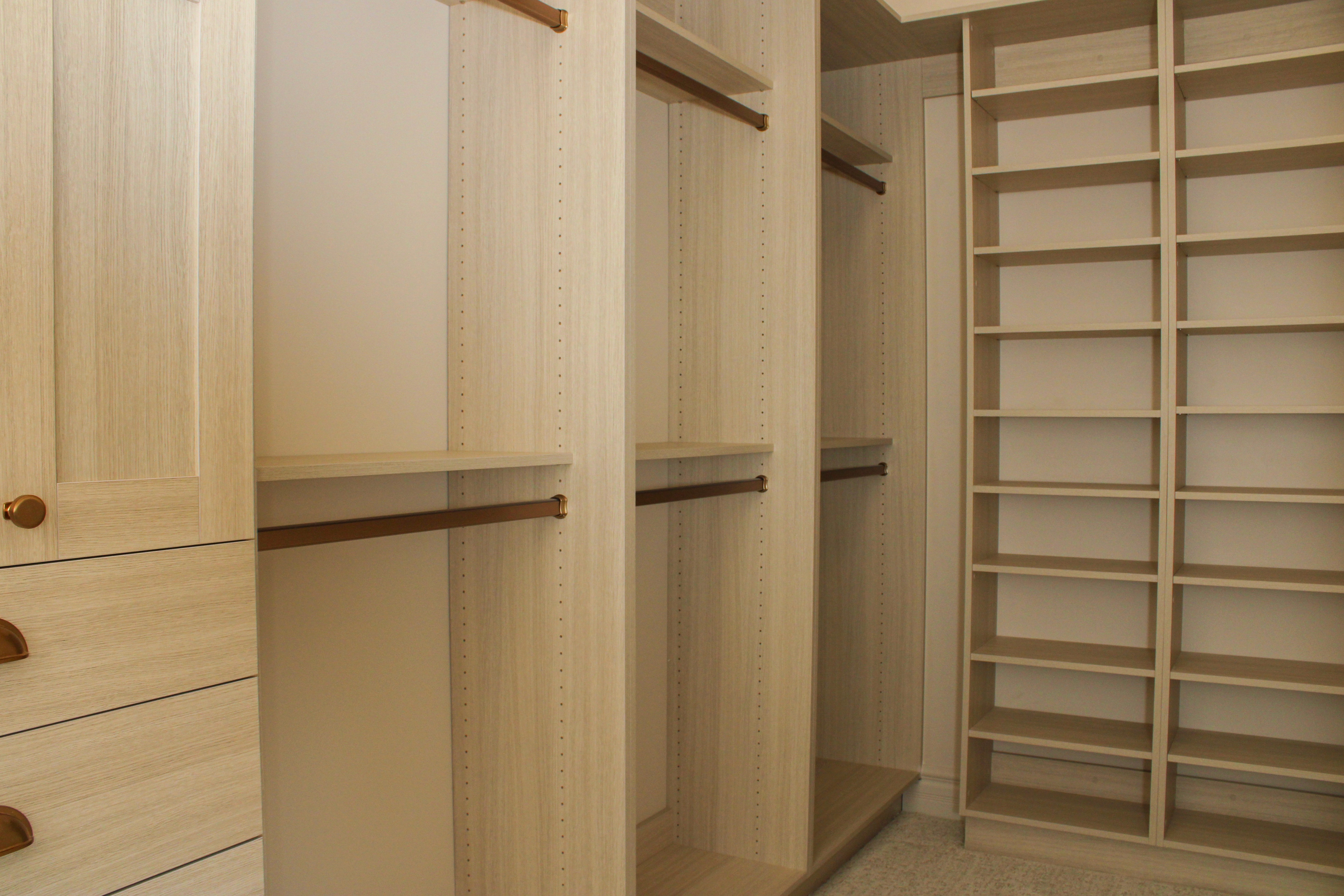 Master closet featuring built-in shelving and organized storage in a St. George, Utah home.