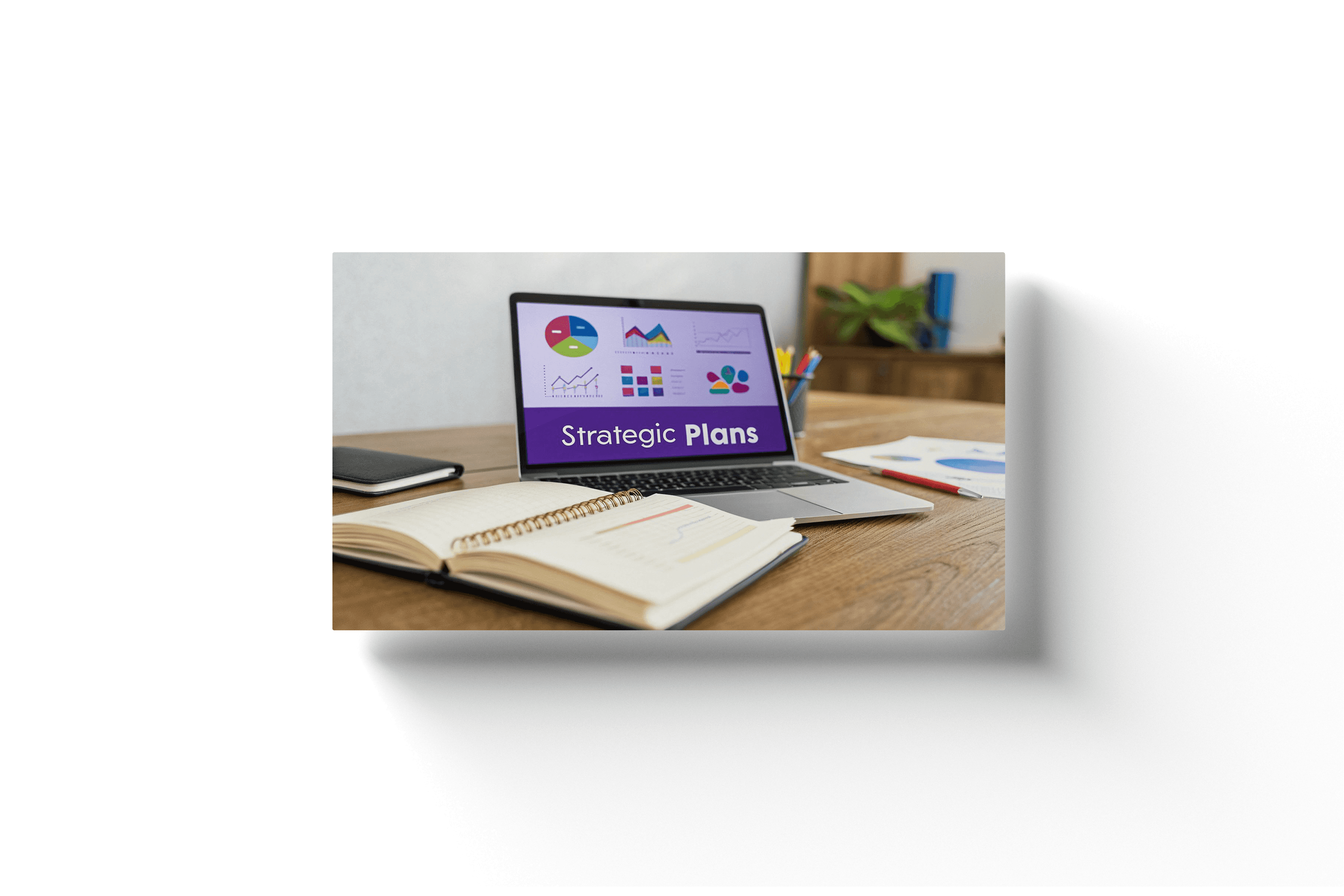 a laptop with a purple screen showing 'strategic marketing plans''