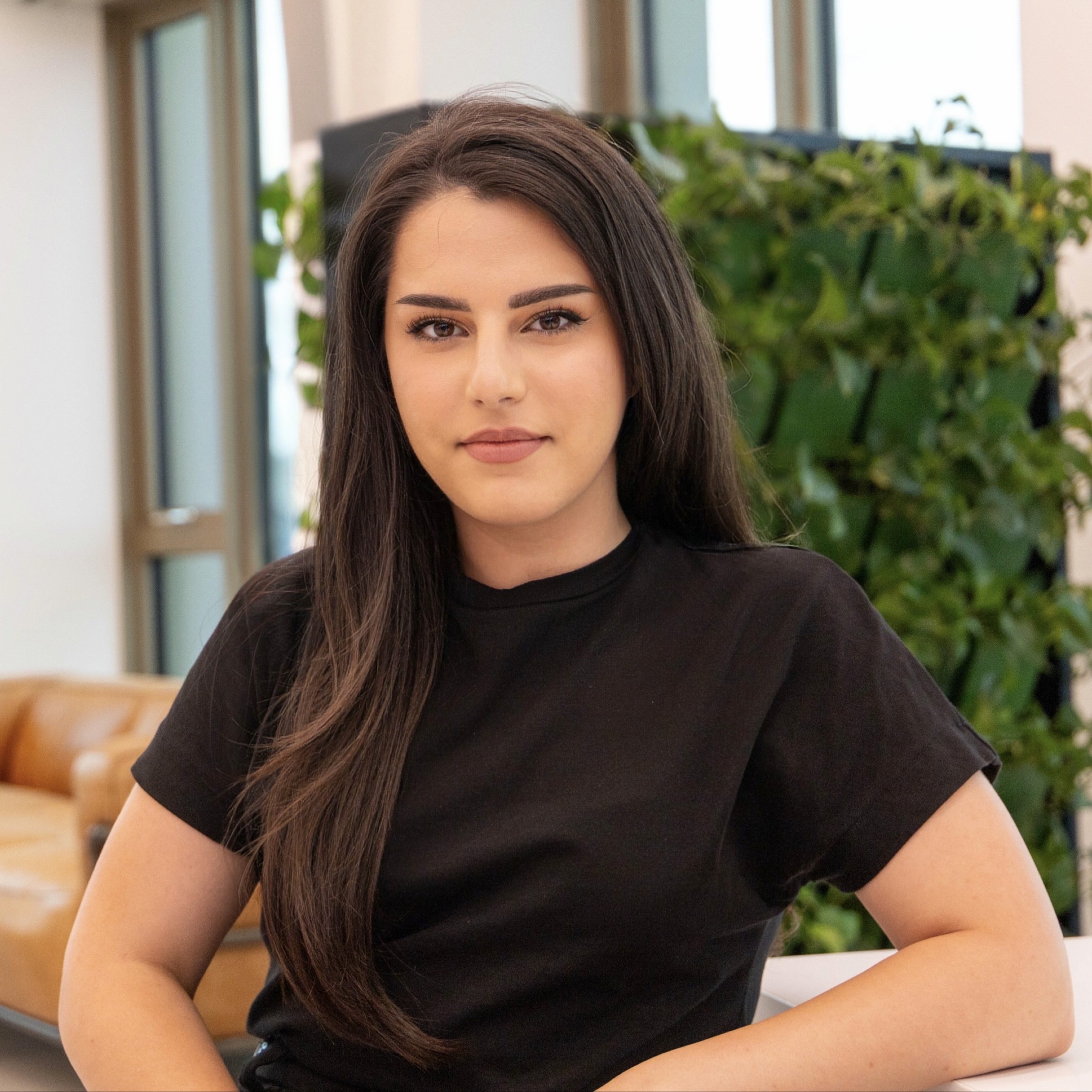 Side shot of a aman wearing a cap with the sun setting in the background
