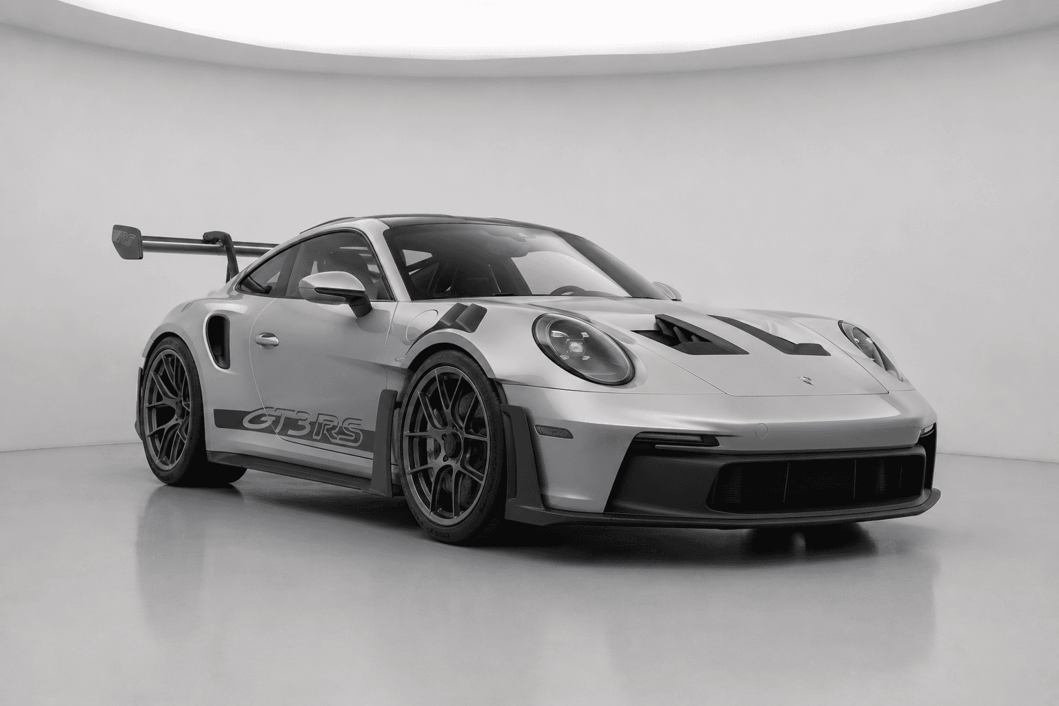 Silver Porsche GT3 RS with black accents, front view