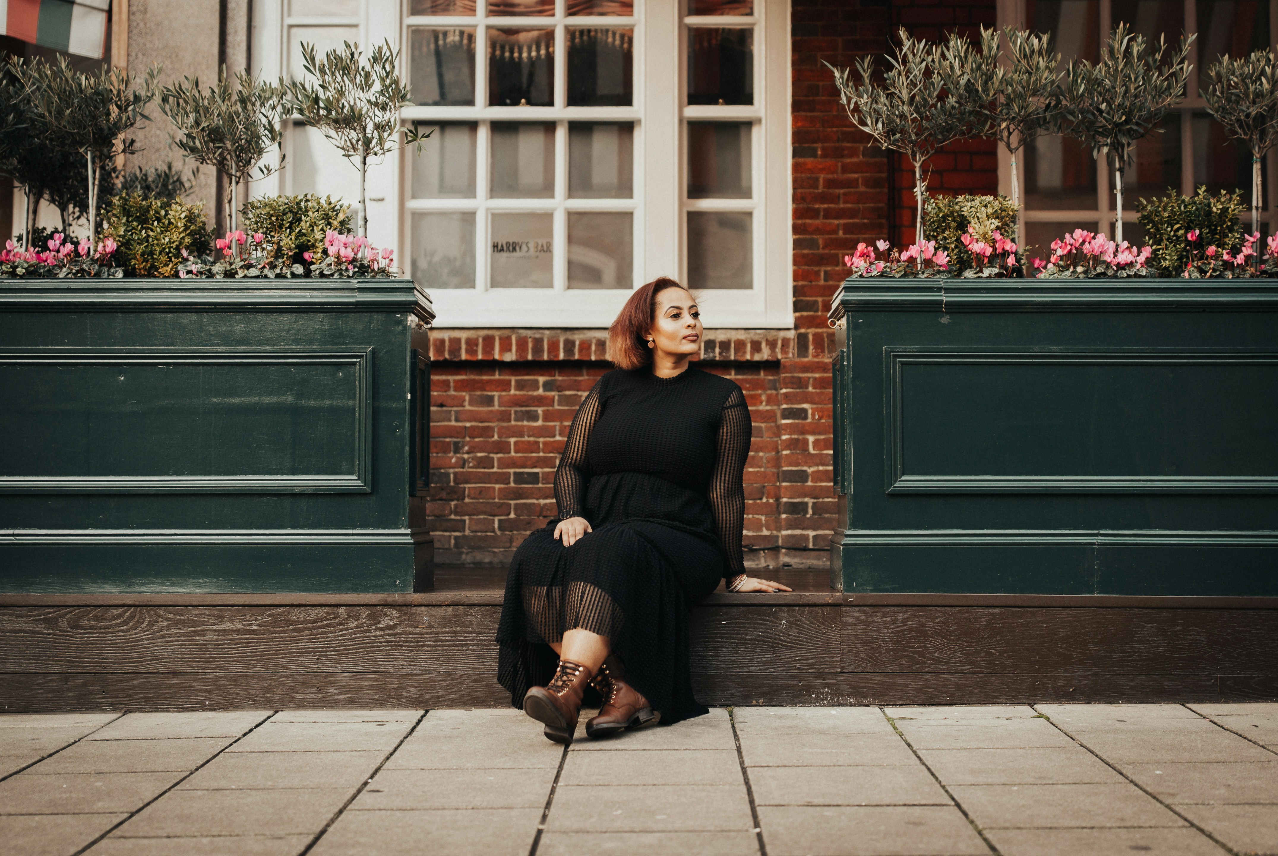 Woman in Black with Flowery Background - Plus Size Fall Outfits