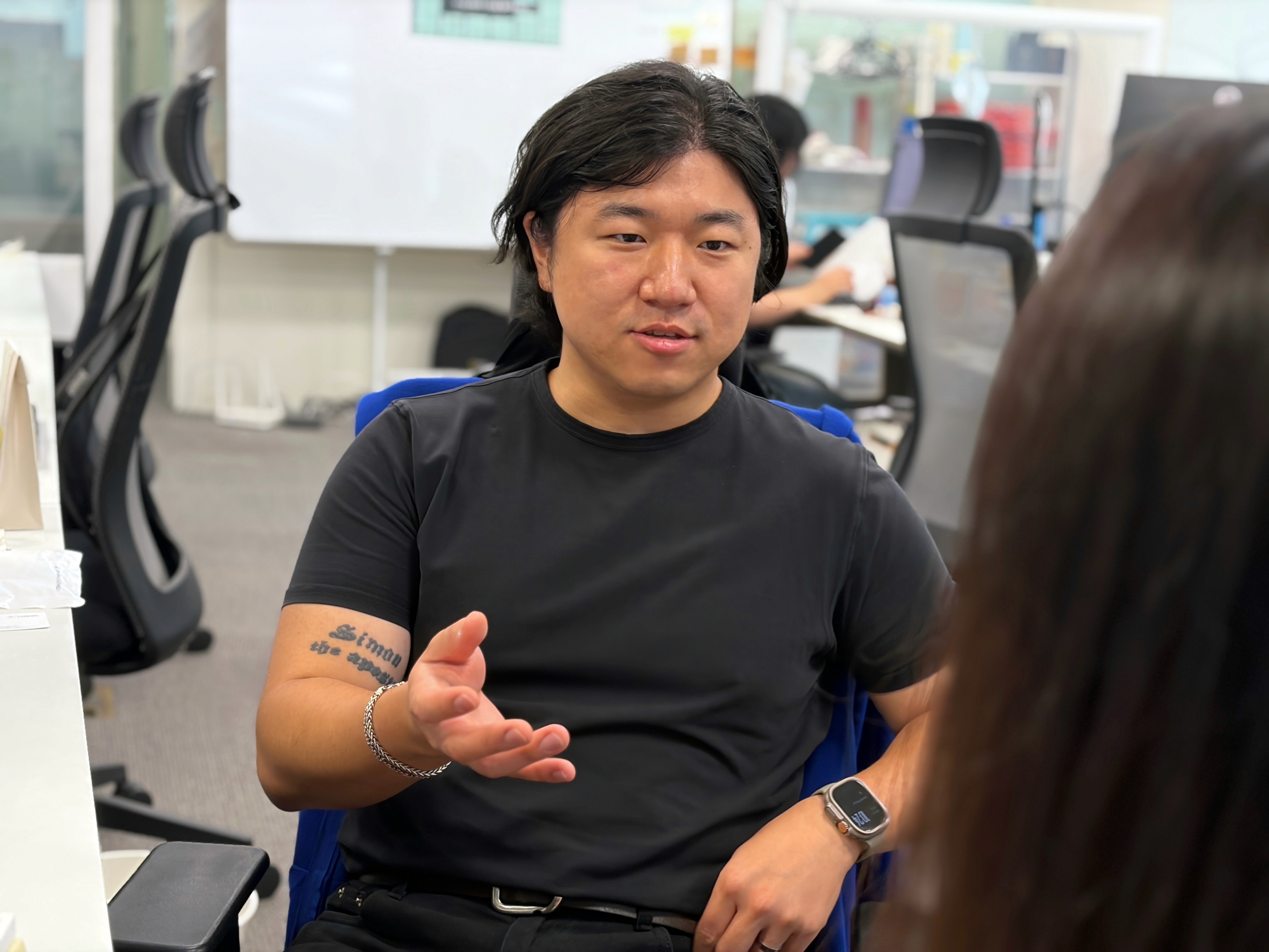 Joe discussing product improvements with a colleague