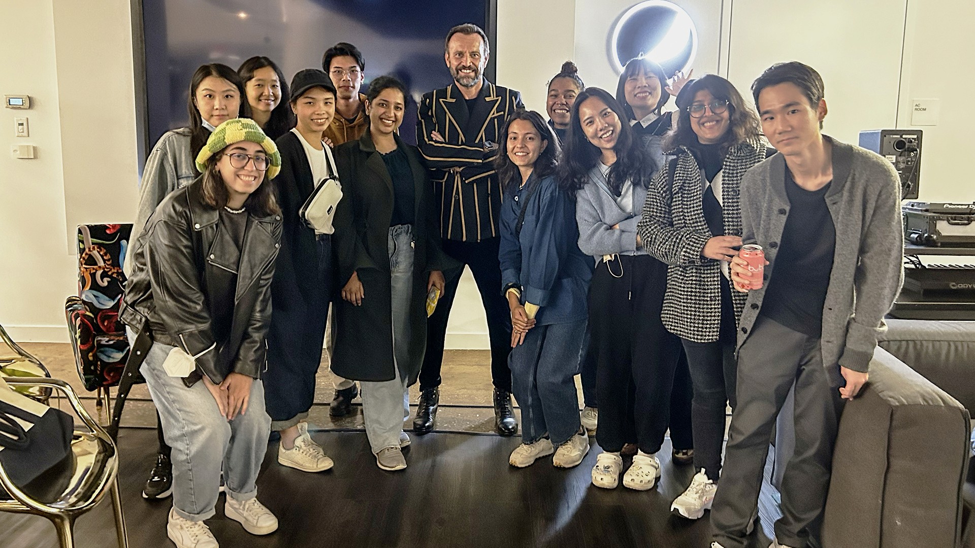 group portrait of students at PepsiCo headquarters with Mauro Porcini