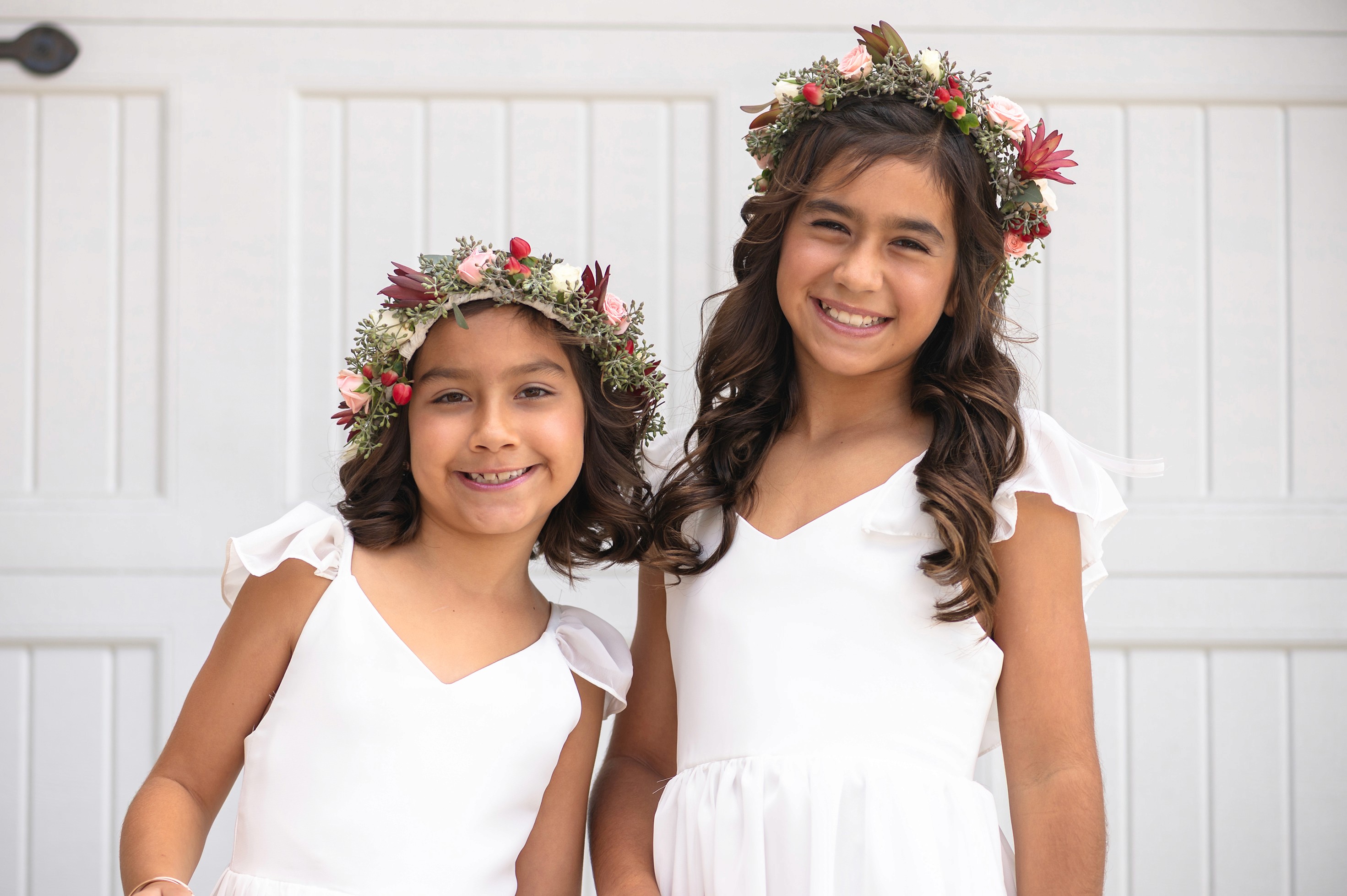 Flat lay wedding details with bouquet, rings, and sparkling bridal heels