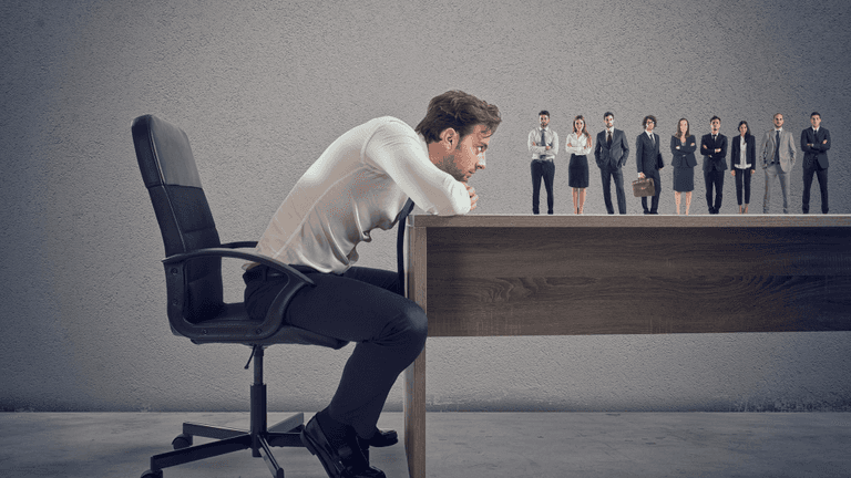 Close-up of a sleek dark green SUV with modern design elements, illuminated against a dark green background.