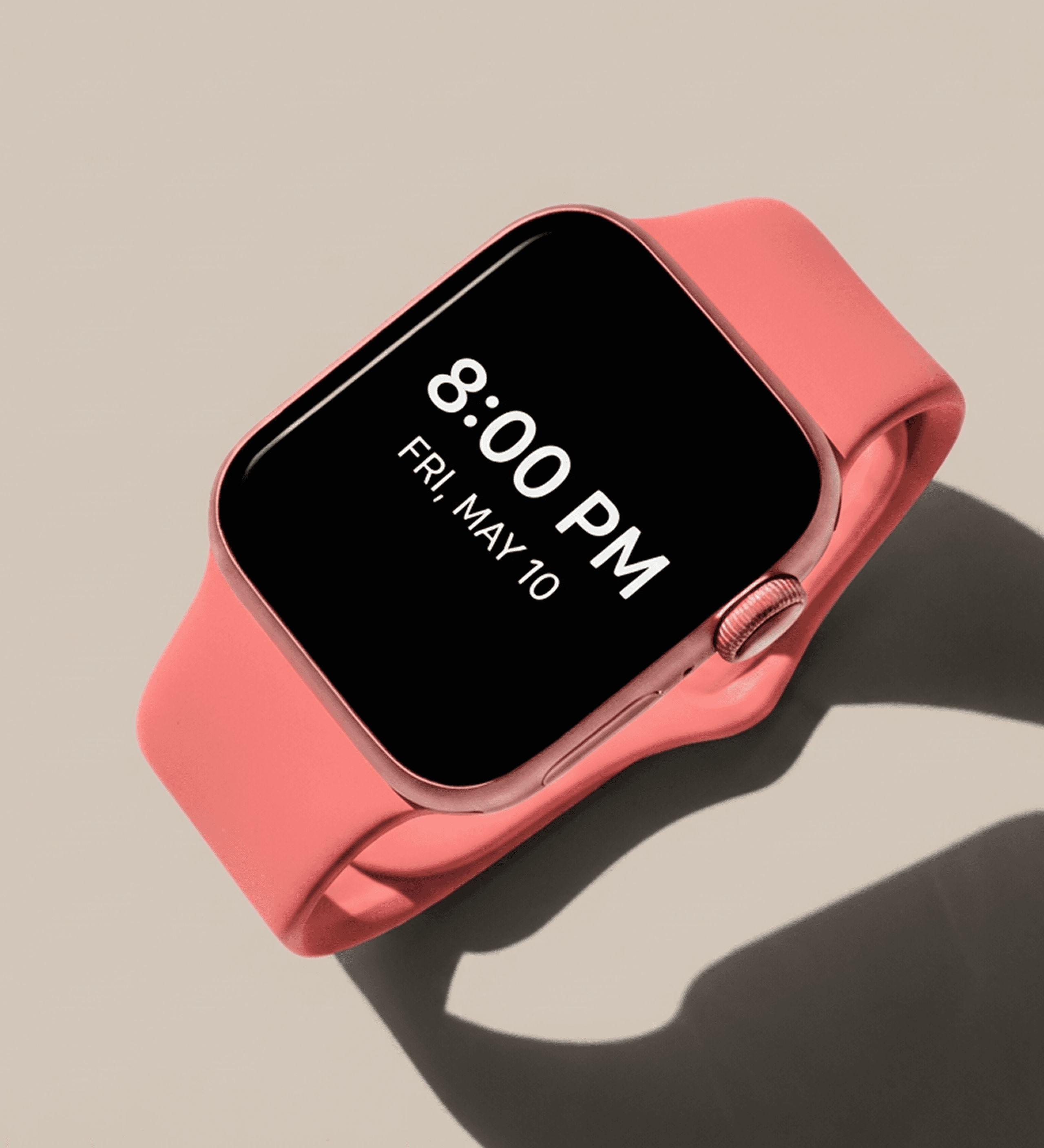 A smartwatch with a pink band displays the time as 8:00 PM on Friday, May 10.