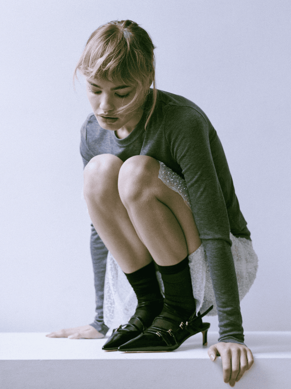Laptop displaying website on wooden table