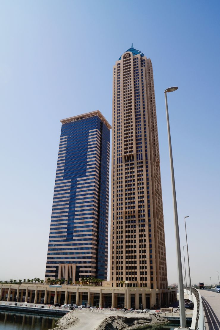 Churchill Tower overlooking the Dubai Canal, representing the pinnacle of waterfront urban living and investment.