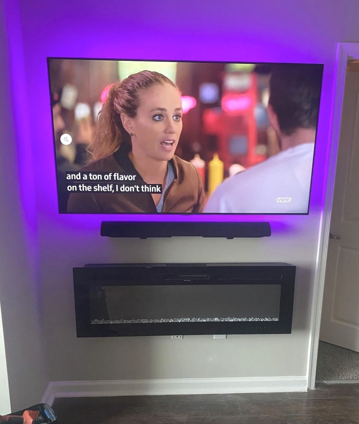 65 inch TV Mounted with soundbar and LED