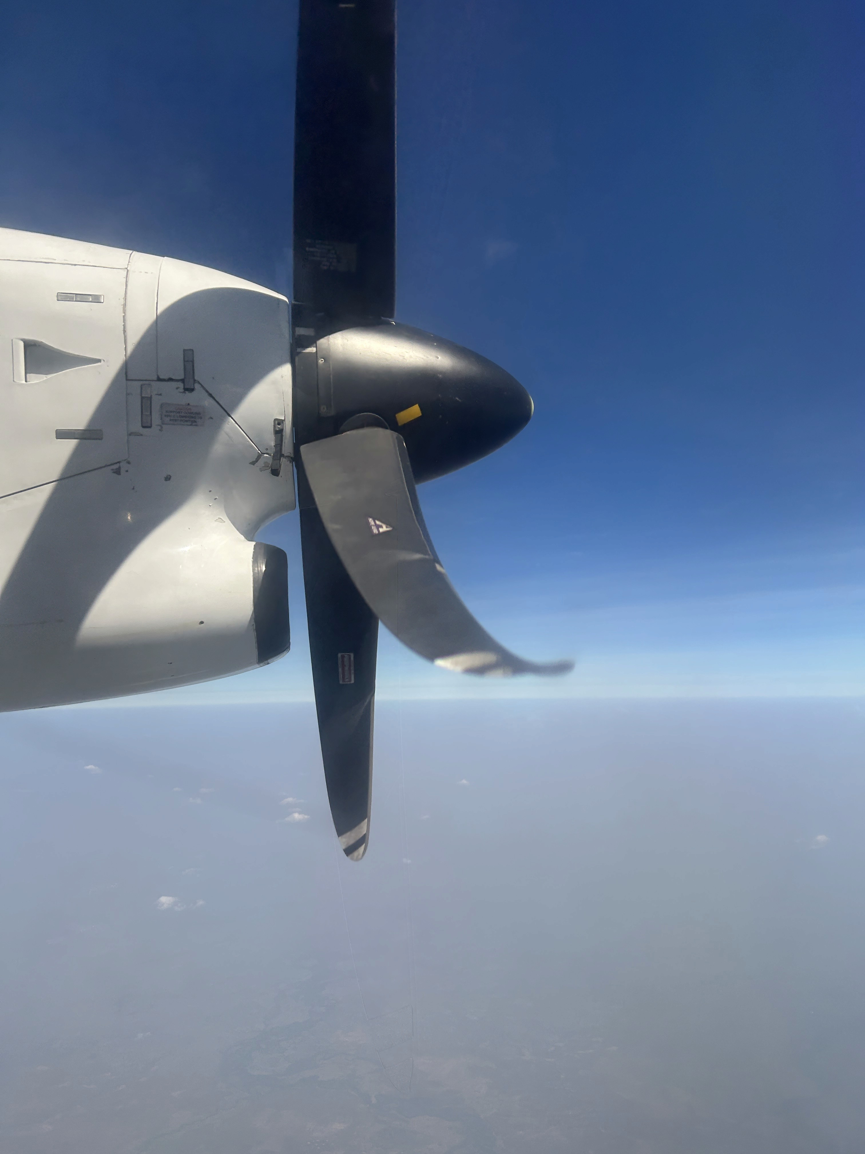 a group of people walking on a sidewalk