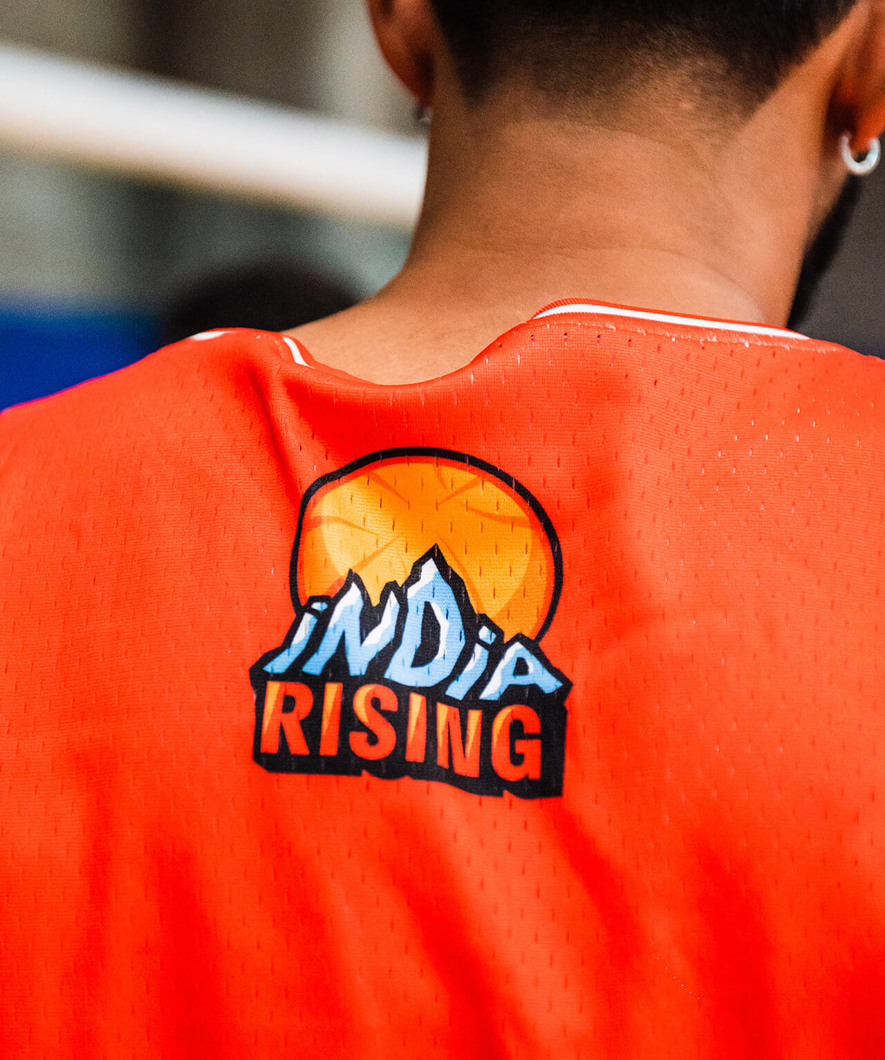 A closeup of the back of an India Rising jersey, featuring the logo