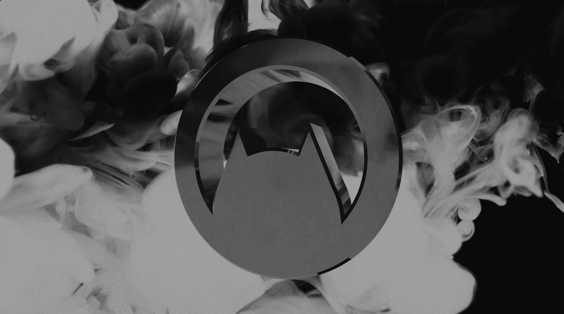 A 3D logo sitting in a space surrounded by smoke.