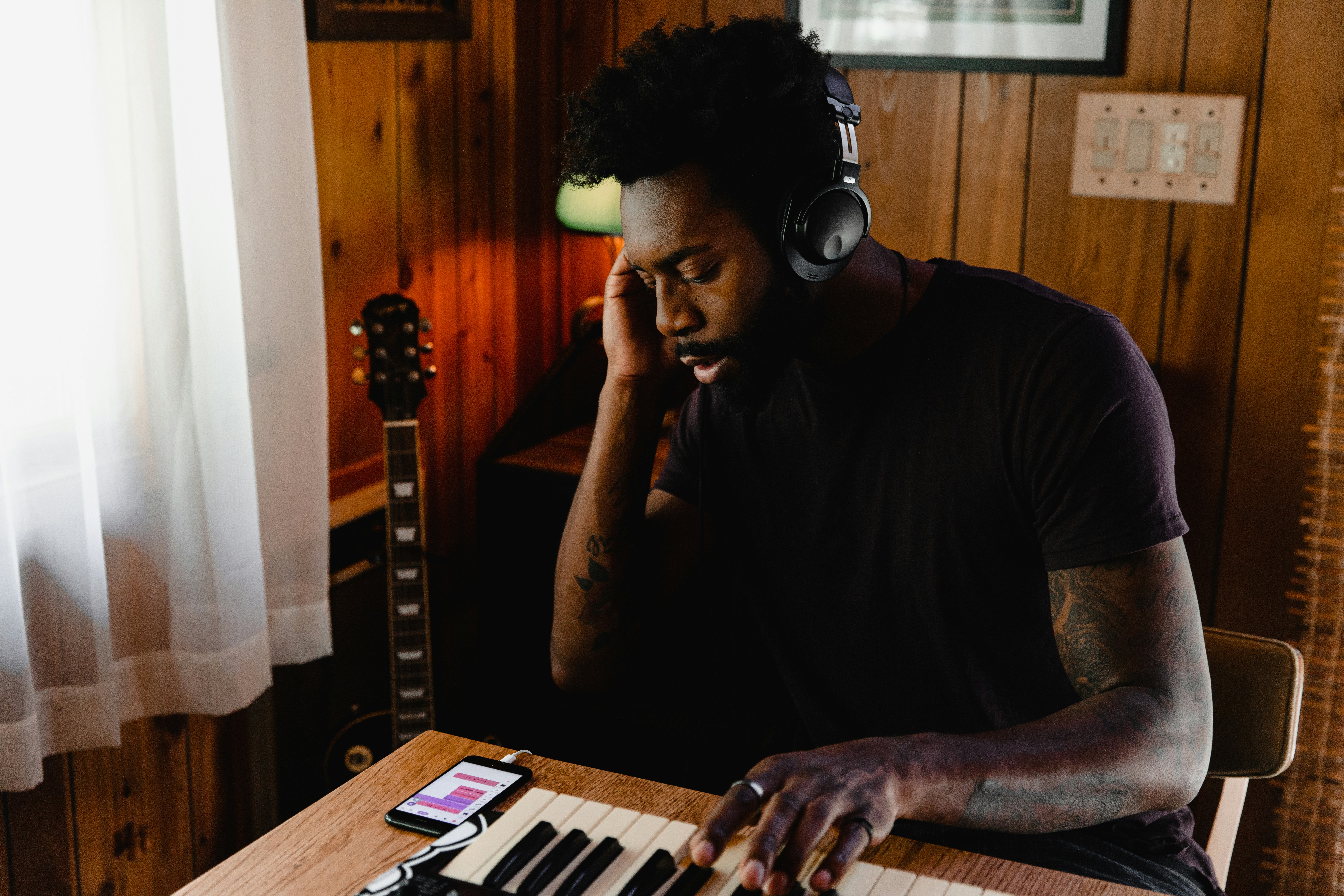 man playing music - Books on Music Production