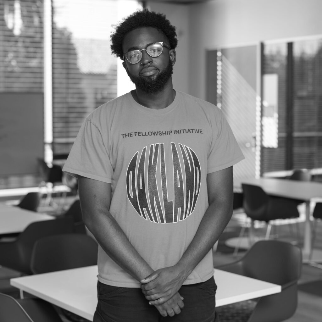 black and white image of a black man looking at the camera