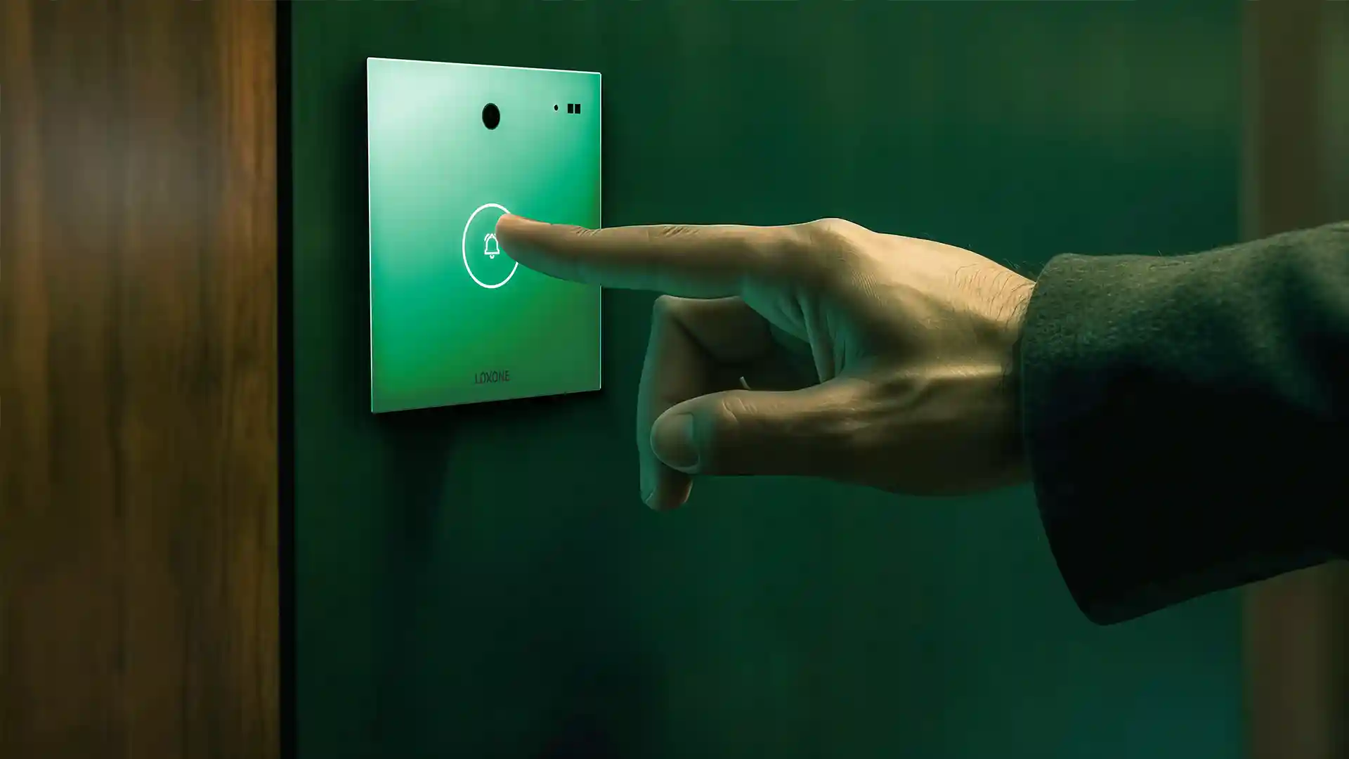 a person pressing the button on Loxone intercom