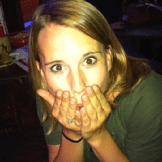portrait of a woman covering her mouth with her both hands