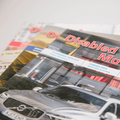 Series of printed magazines stacked on top of each other.