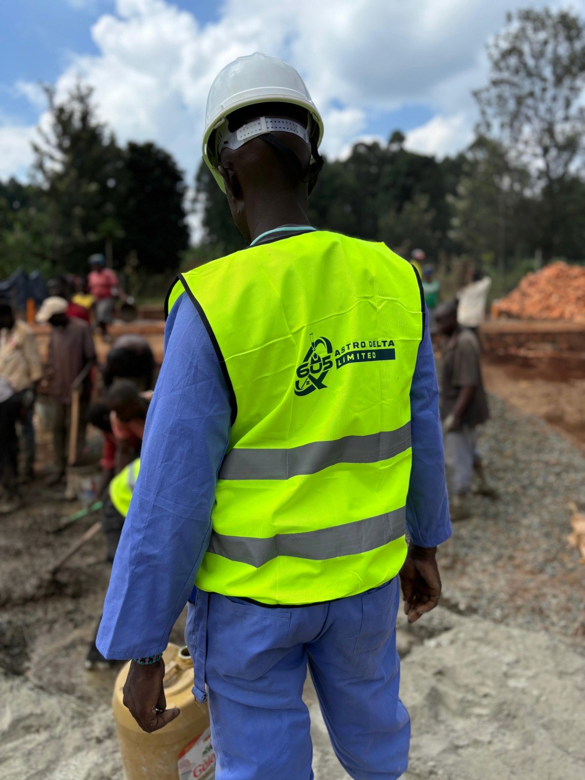 Construction contractor wearing a hard hat and smiling