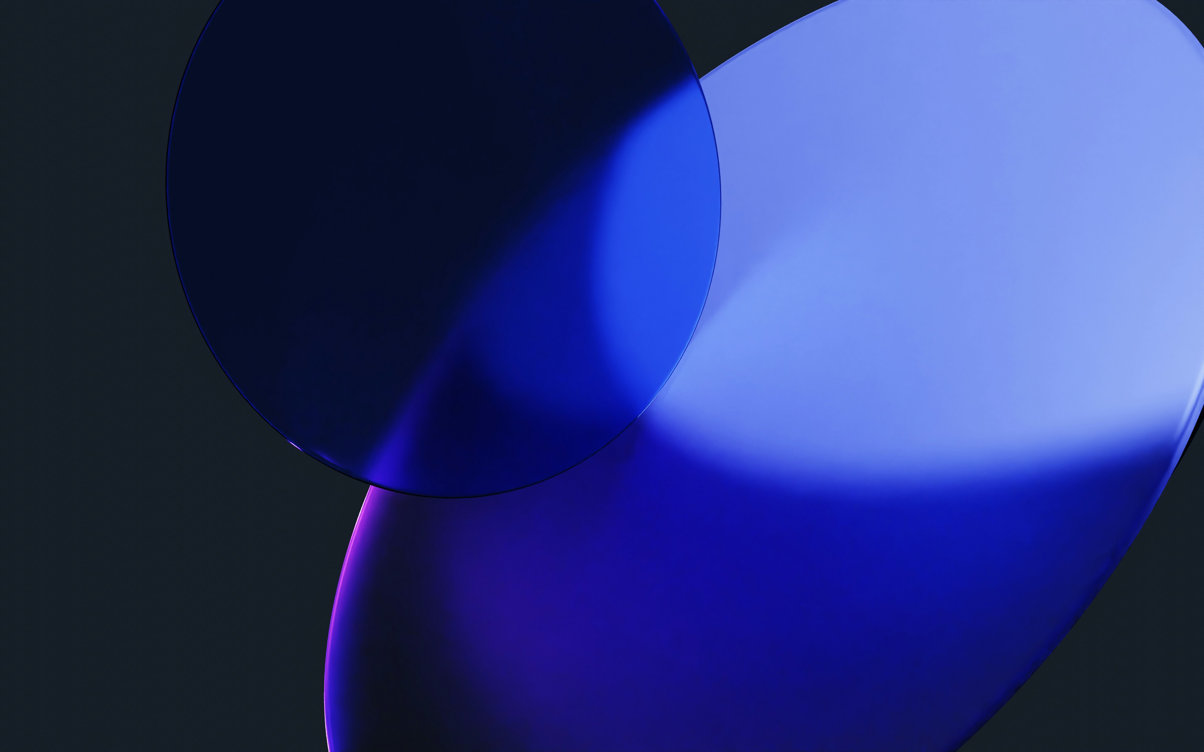 Abstract blue and purple shapes on dark background