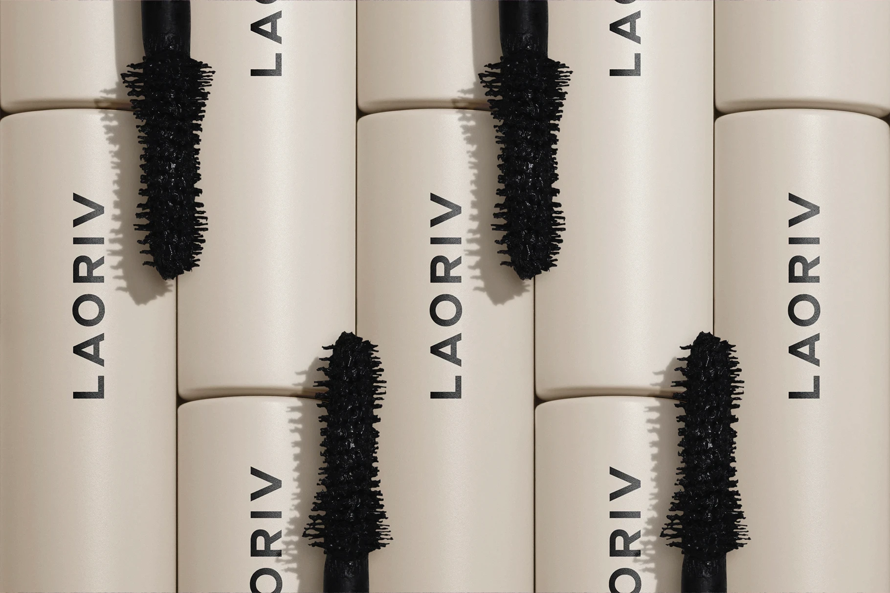 Cosmetic branding mockup featuring a close-up of beige mascara tubes and wands.