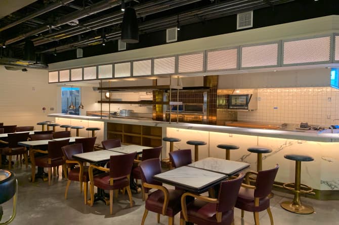 A cafeteria like seating area with modern decor