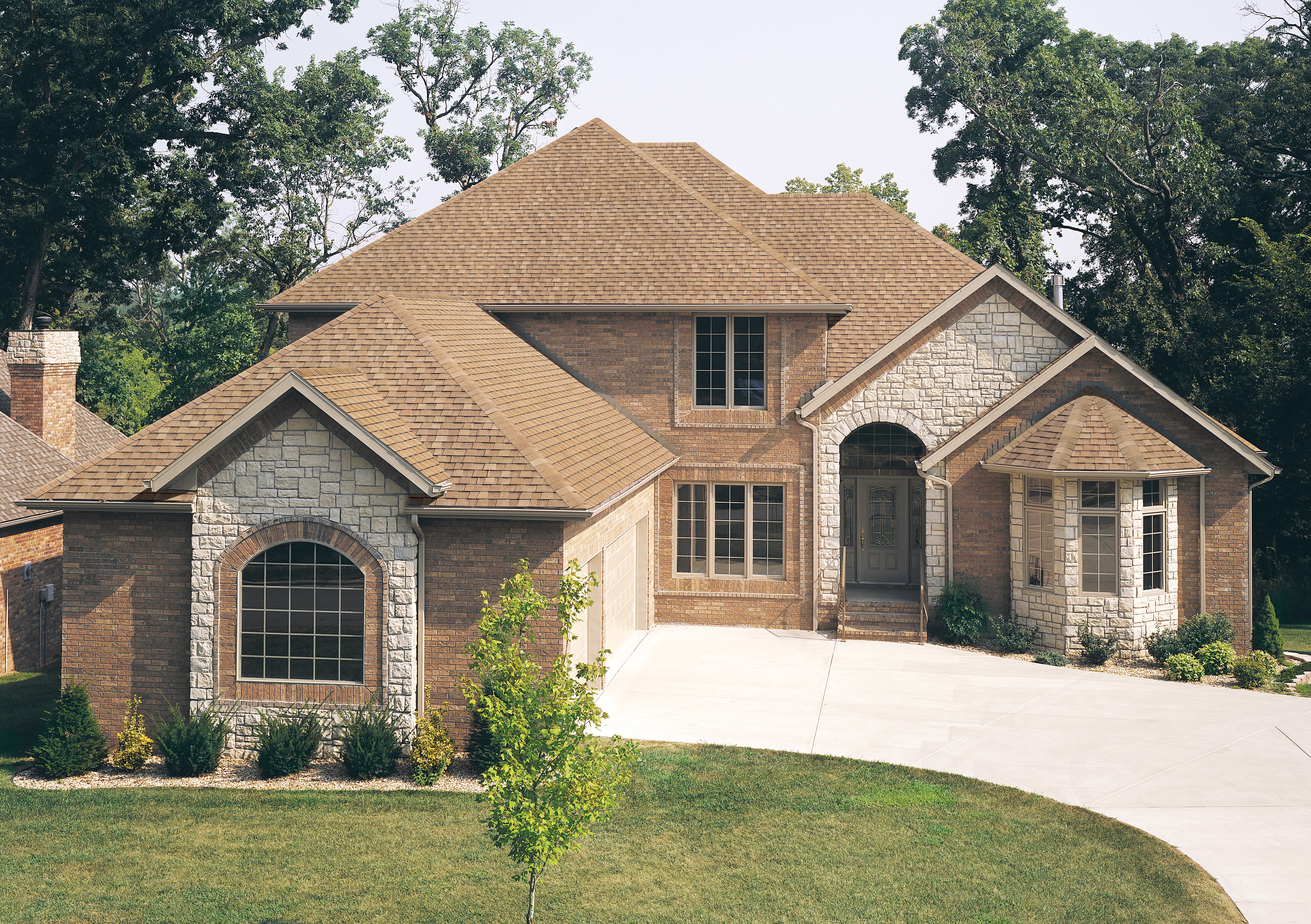 TAMKO Heritage architectural shingles in Rustic Cedar, manufacturer photo.