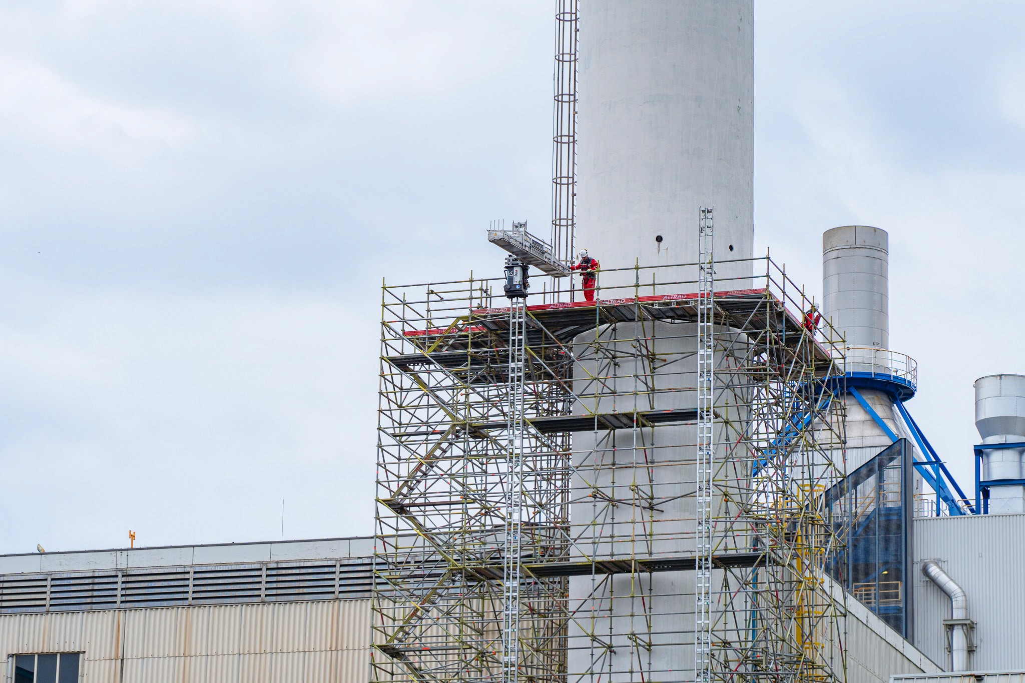 LIFTBOT lifting robot on scaffold at Nobian chemical plant chimney, 30 metres