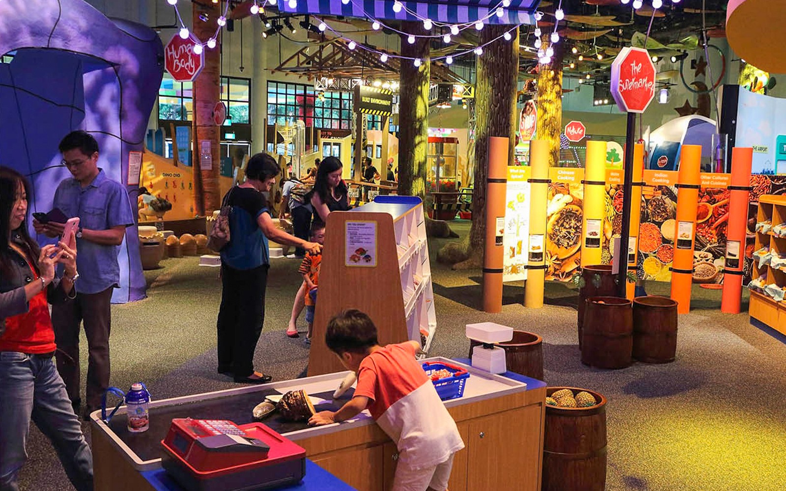 Interactive exhibit at Science Centre Singapore with visitors exploring displays.