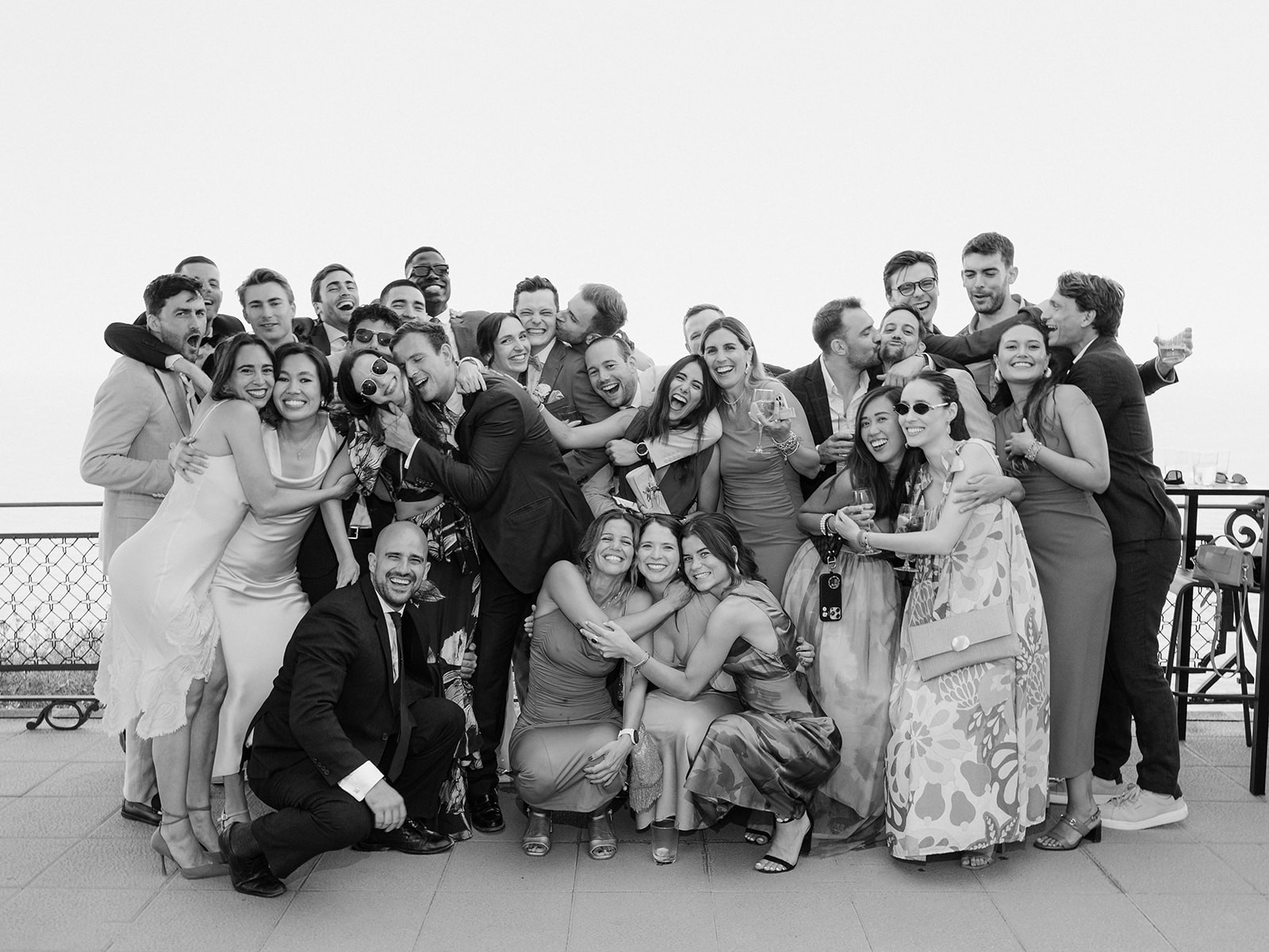 A scenic view of a garden with neatly trimmed hedges and trees, featuring a modern building in the background.